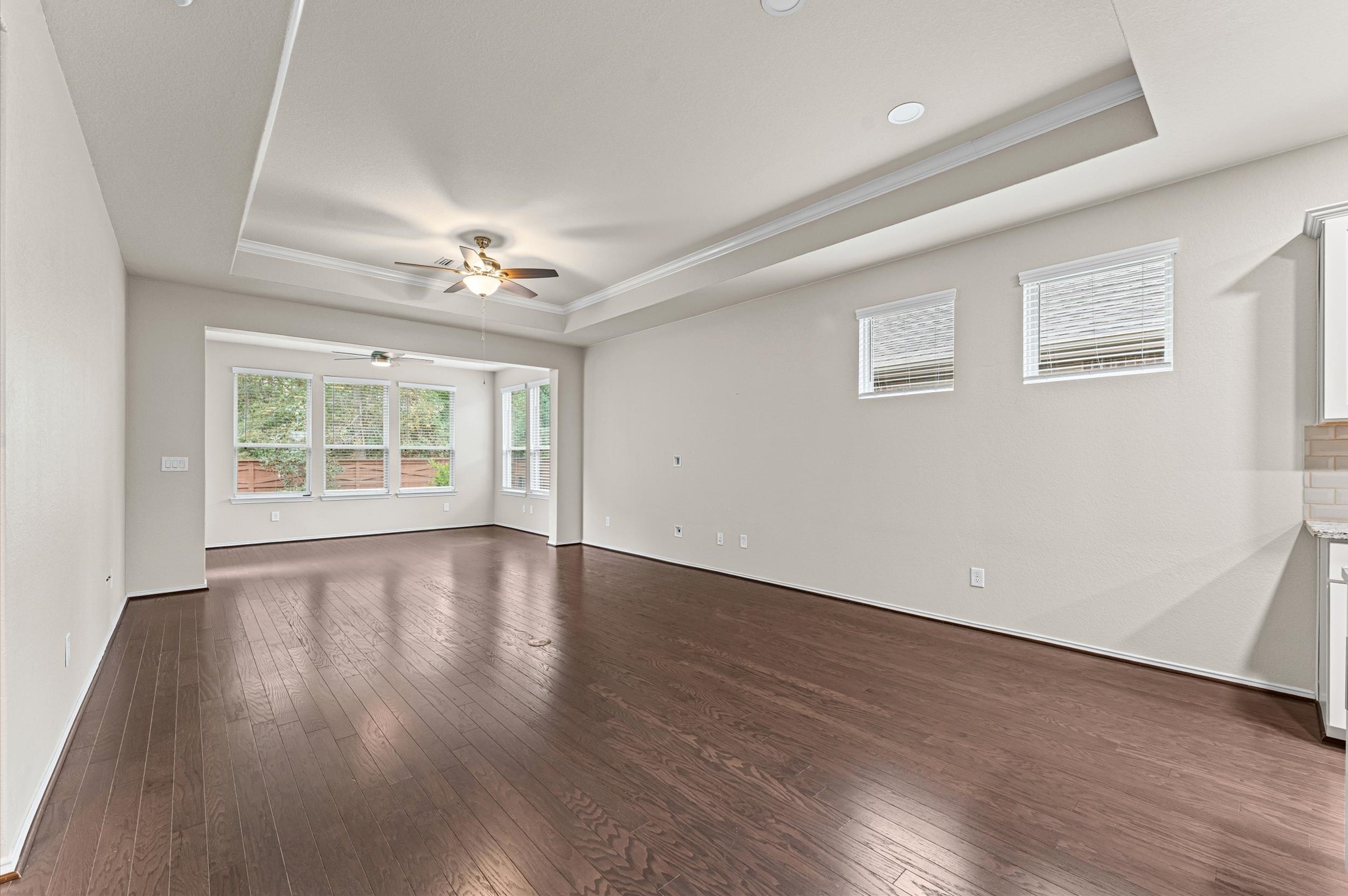 Anchored by dramatic, soaring vaulted ceilings, the expansive living room offers a magnificent, airy volume that forms the perfect center for effortless relaxation or upscale entertaining..