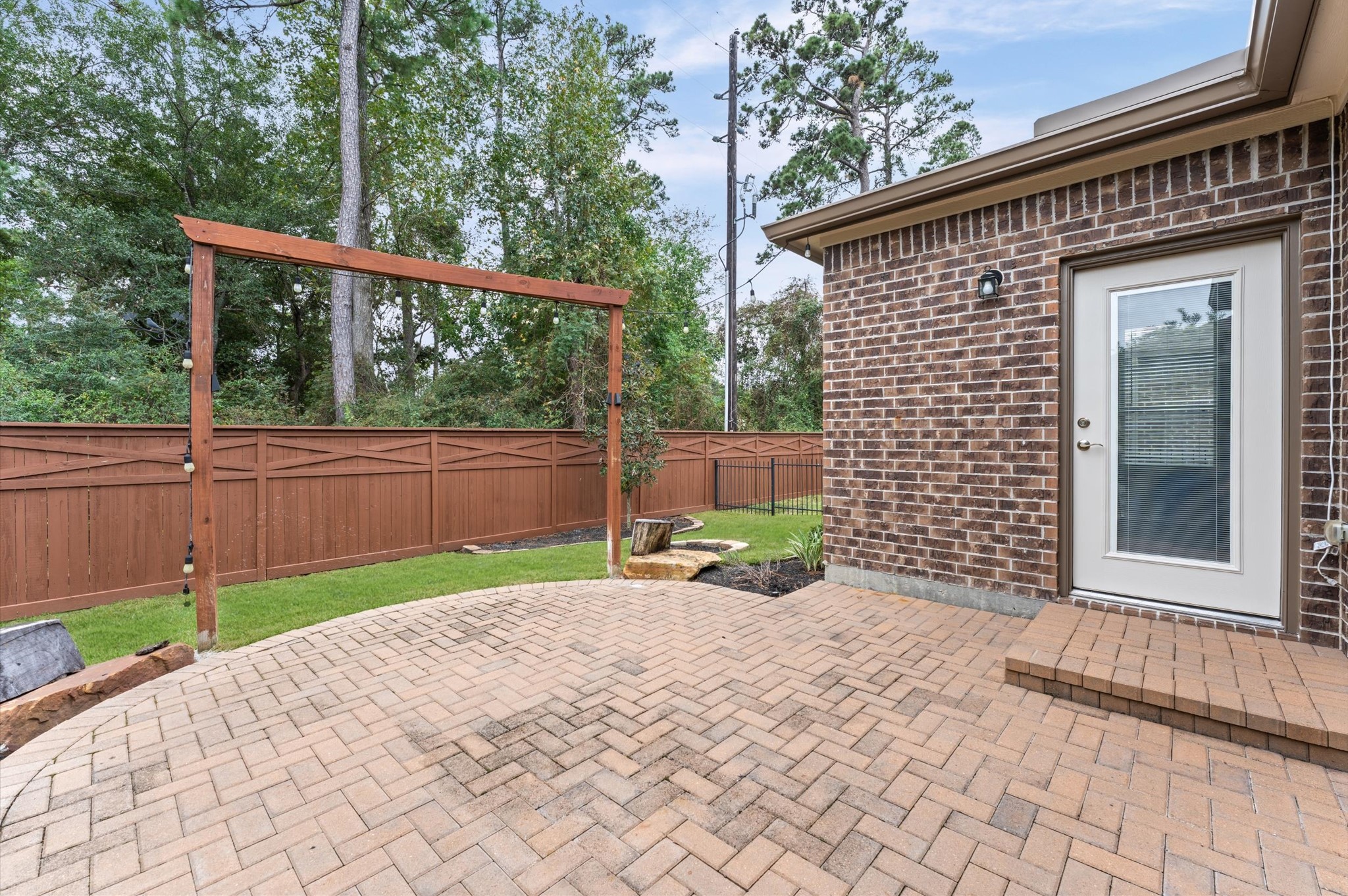 The backyard patio optimized for both personal relaxation and entertaining guests, allowing people to socialize, dine, or lounge comfortably without crowding the space.
