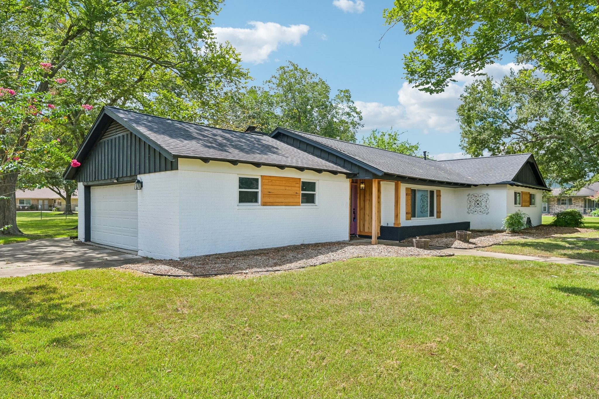 Corner lot on a quiet street with gorgeous yard space all the way around.