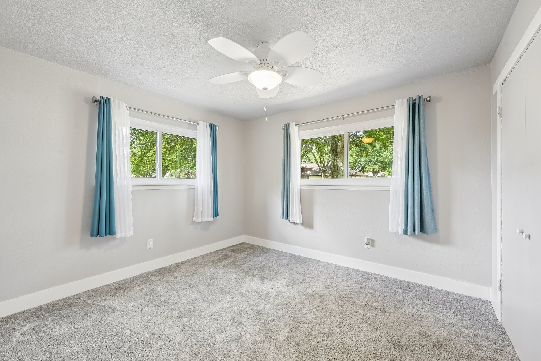 Large secondary bedroom with plenty of natural light.