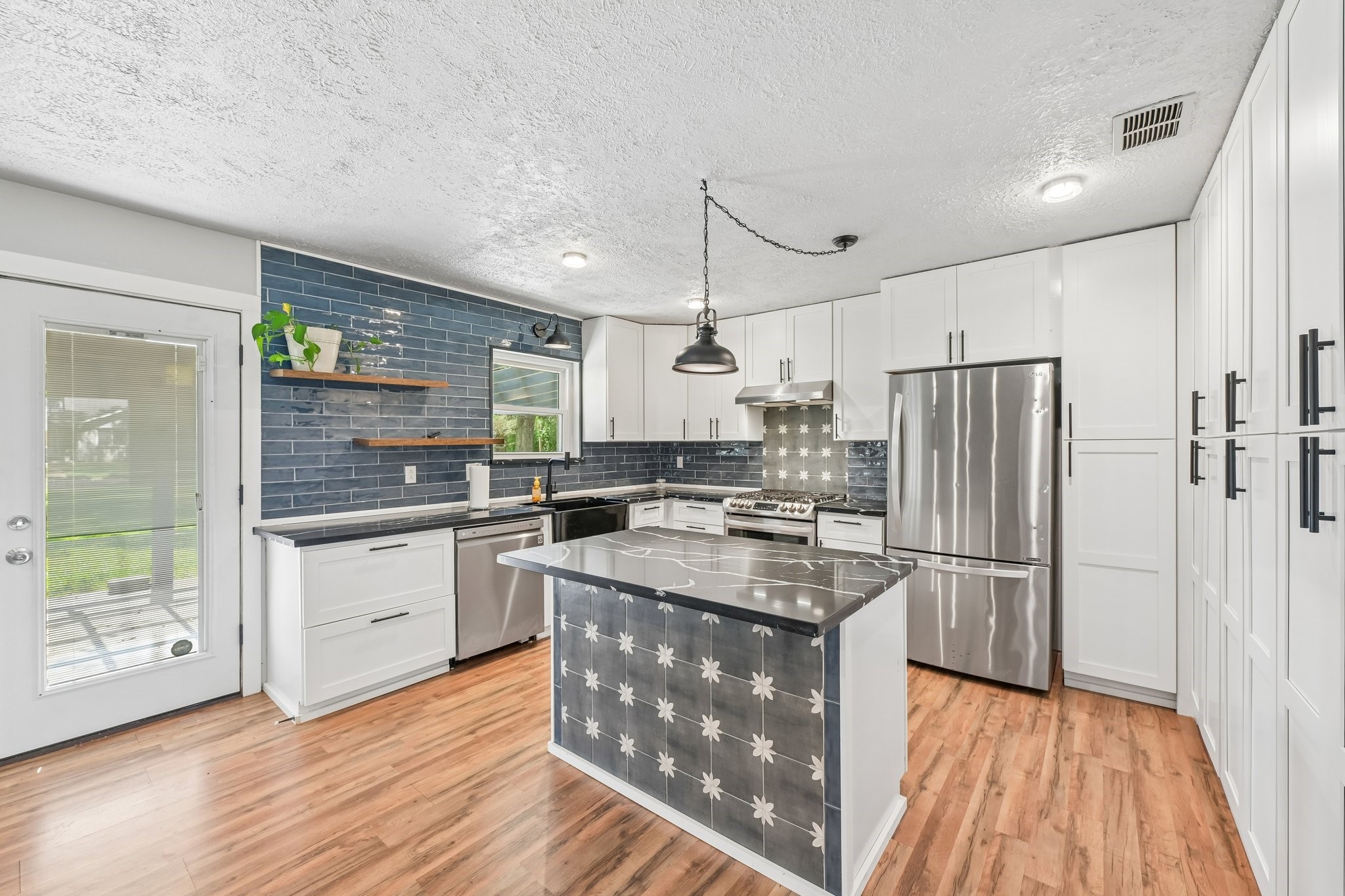 Fully remodeled and updated kitchen complete with LG stainless steel appliances.