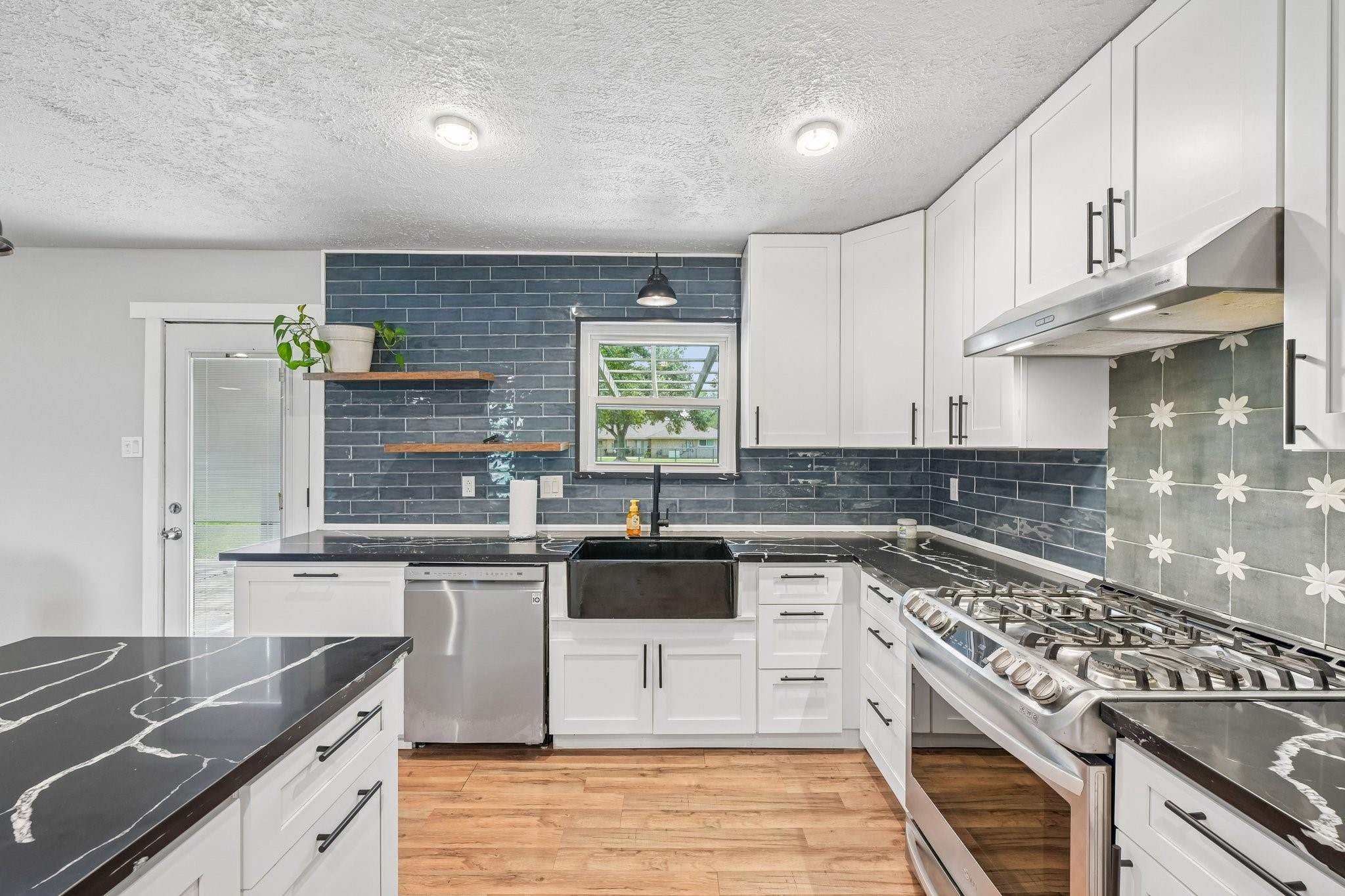 Gorgeous granite, and the beautiful backsplash compliments it all so well.