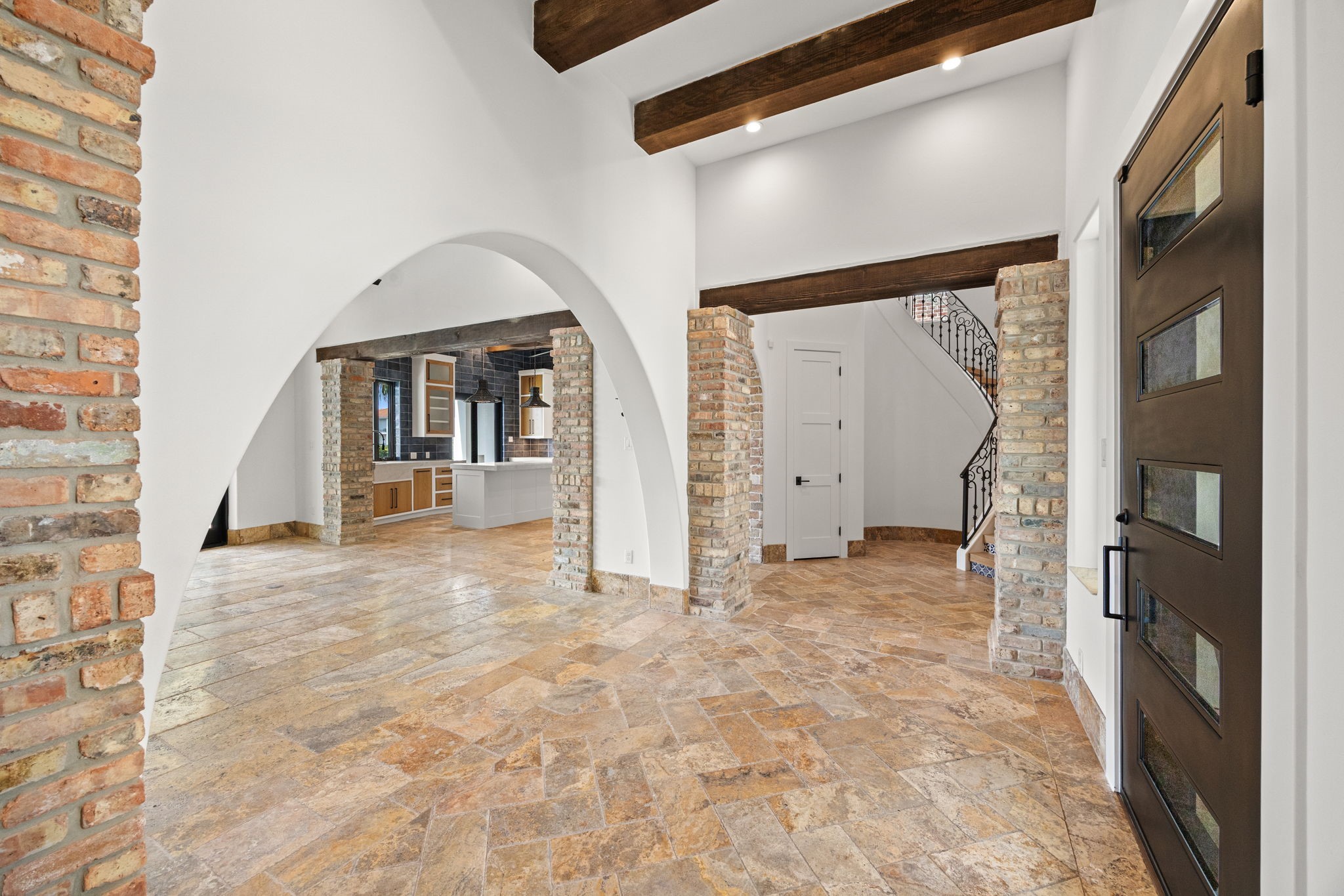 Another angle of the entryway highlights its grand scale and rich architectural detailing, offering a striking first impression from every perspective. Another angle of the entryway highlights its grand scale and rich architectural detailing, offering a striking first impression from every perspective.