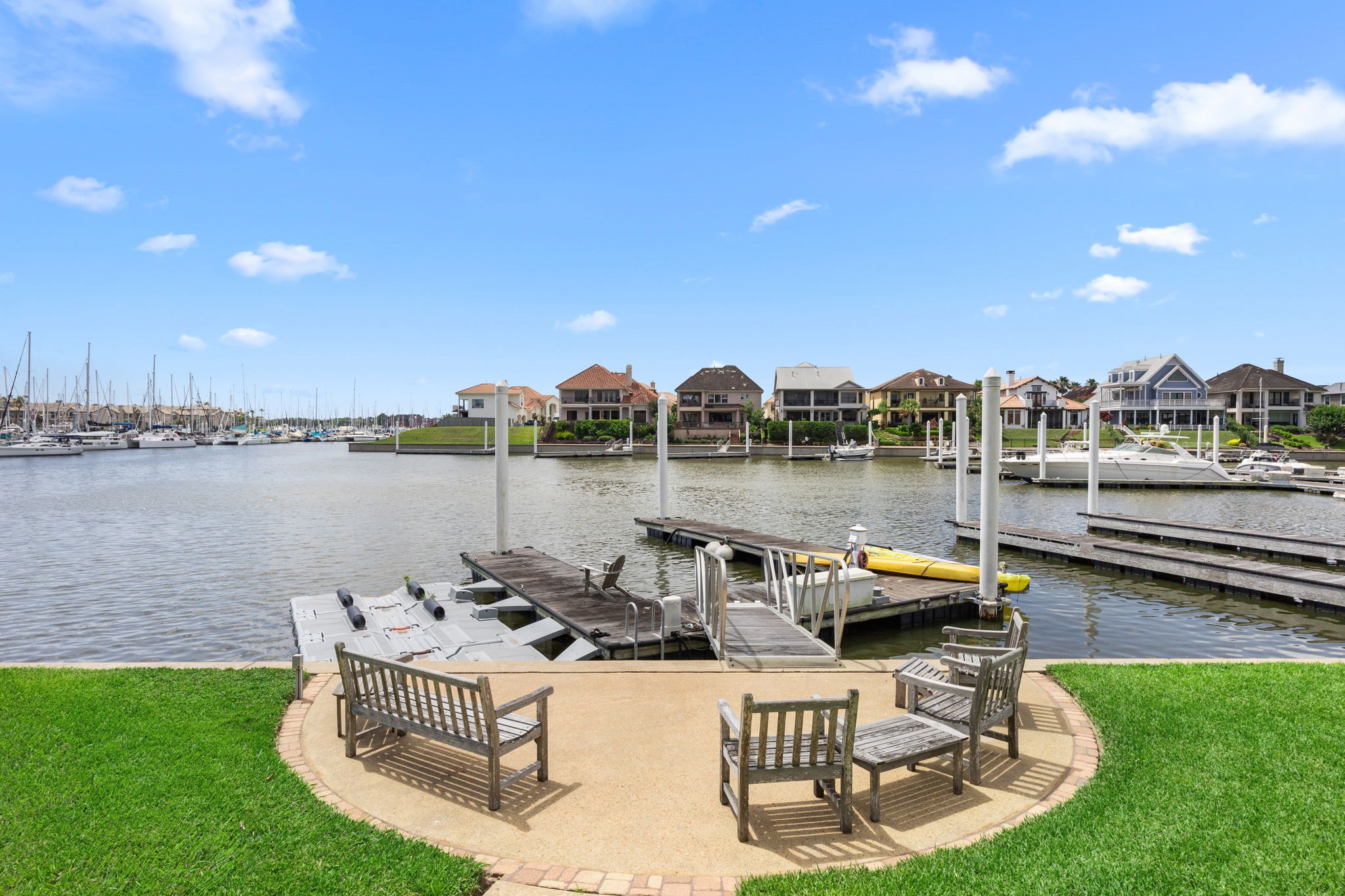 A relaxing sitting area just off the docks provides the perfect spot to enjoy peaceful waterfront views and coastal breezes.
