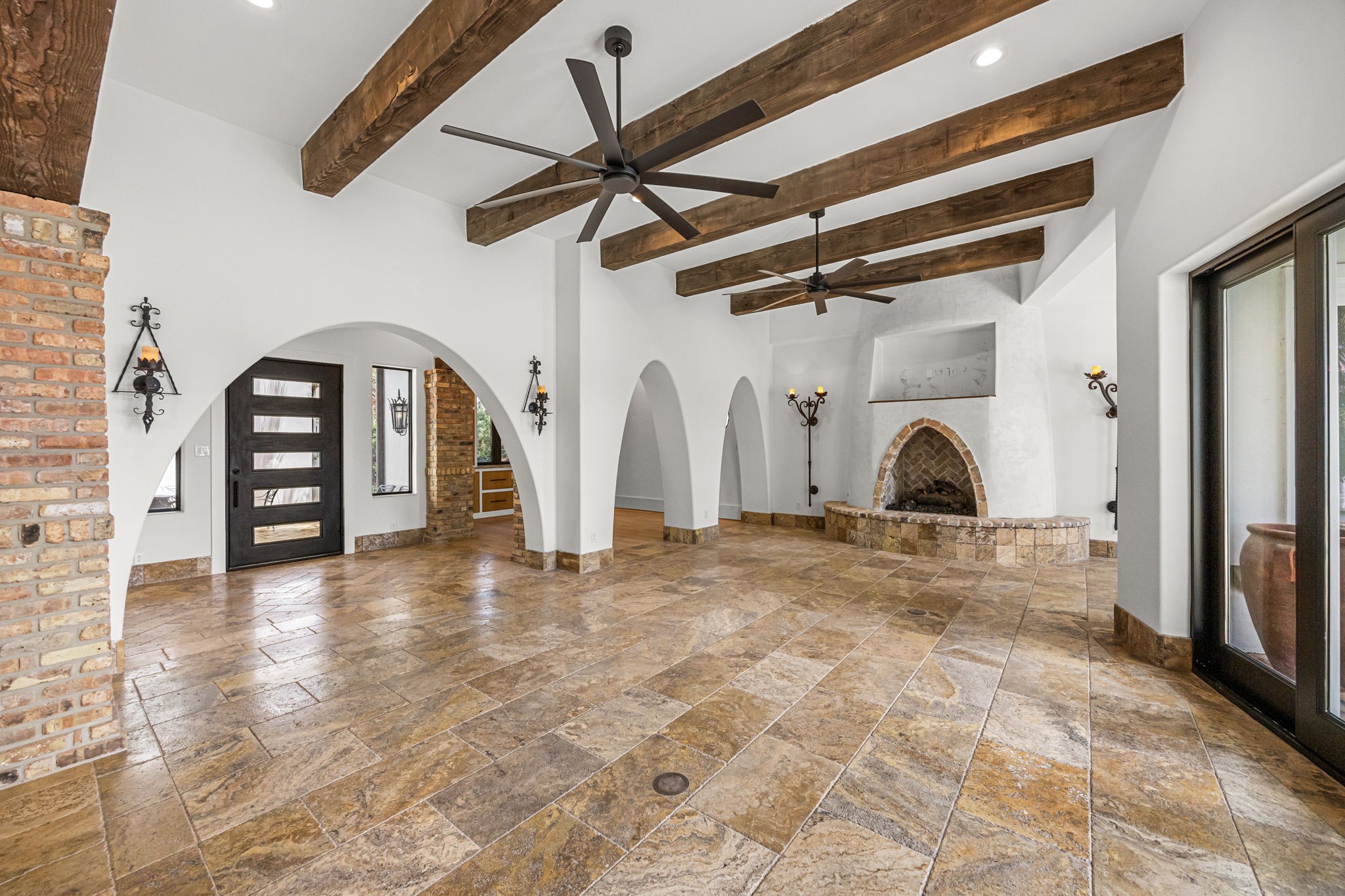 Looking toward the entry, the home's impressive scale is on full display, enhanced by soaring ceilings and thoughtfully curated finishes.