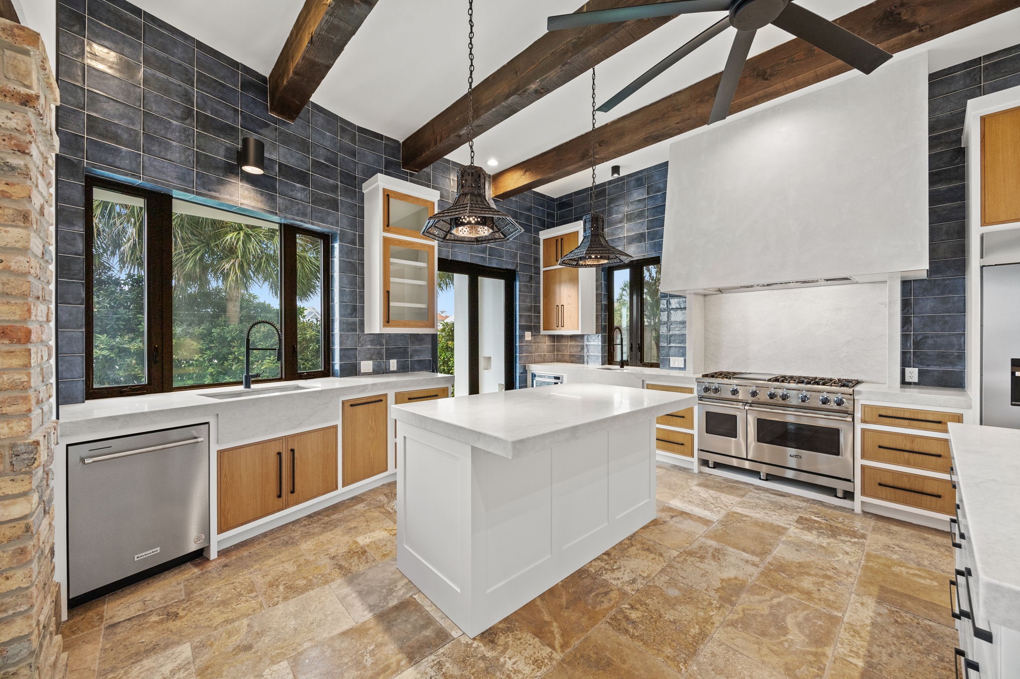 The kitchen is richly layered with exceptional design accents, creating a visually stunning and highly detailed space.