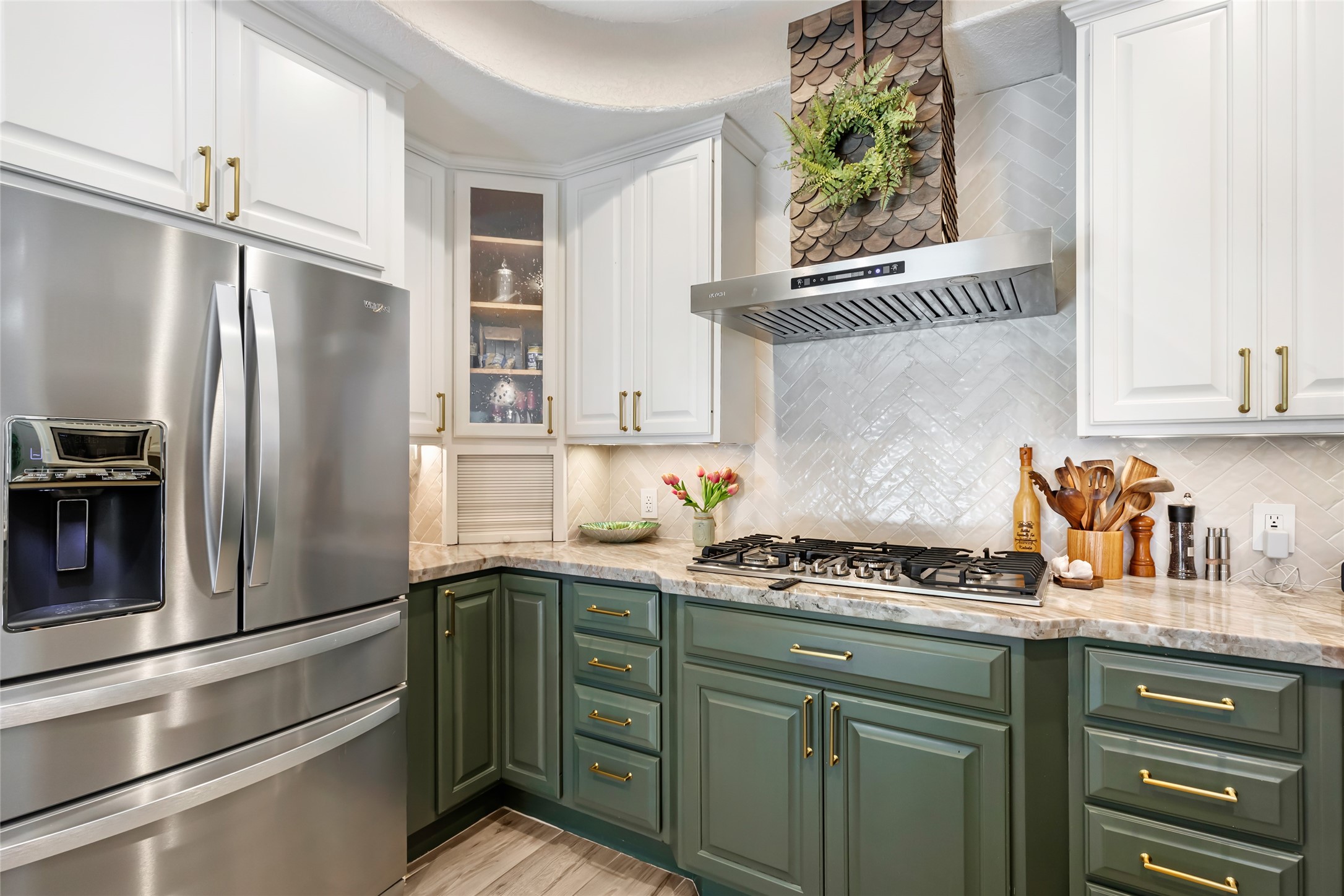 Charming kitchen with elegant two-tone cabinetry, featuring green lower cabinets and white uppers, includes a Chef's dream 1200 CFM vent hood and AMZCHEF gas cooktop! Charming kitchen with elegant two-tone cabinetry, featuring green lower cabinets and white uppers, includes a Chef's dream 1200 CFM vent hood and AMZCHEF gas cooktop!