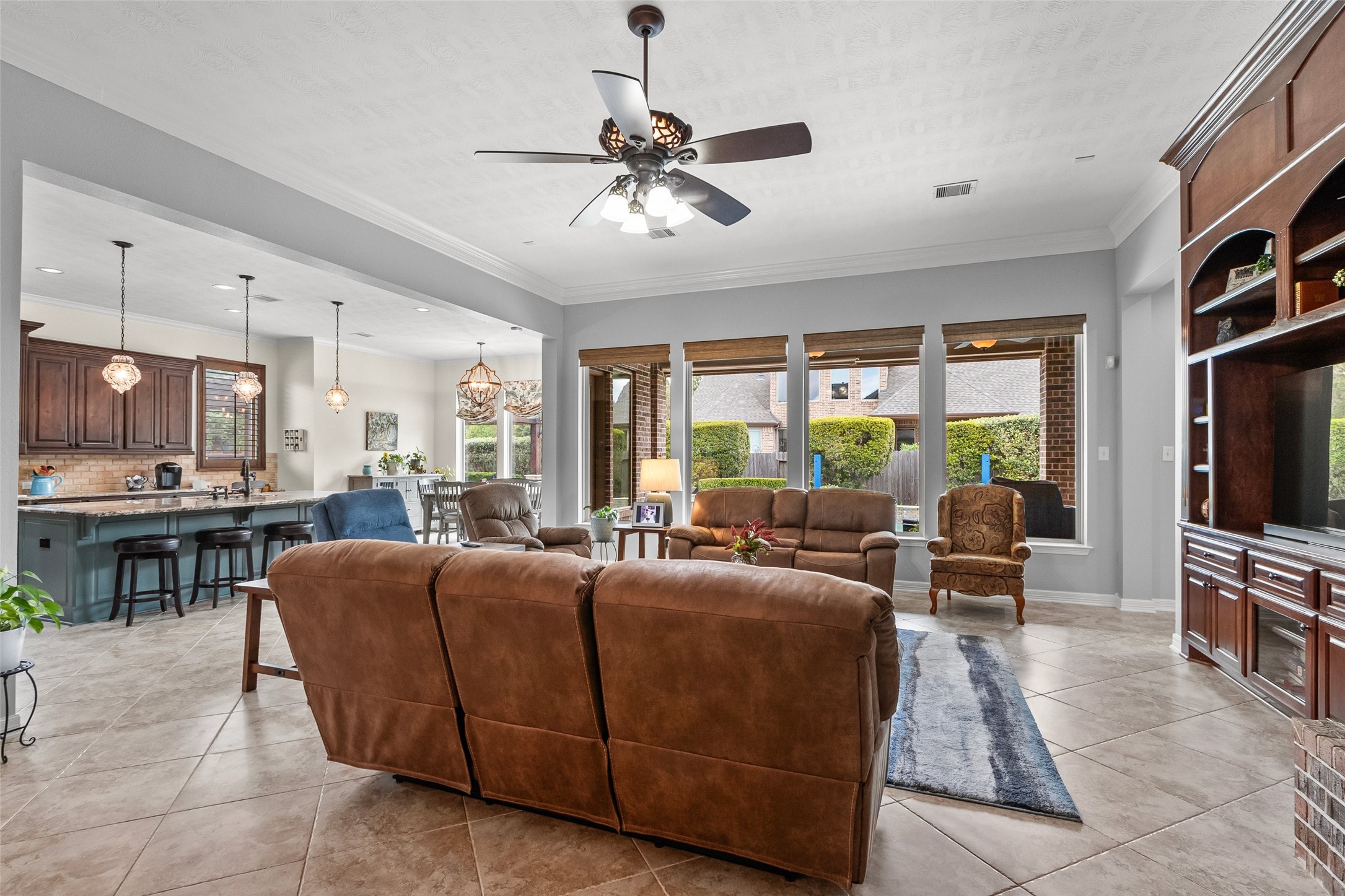 Another view of the family room that highlights the openess to the kitchen and breakfast room. The blinds in the living room operate with ease by remote control.