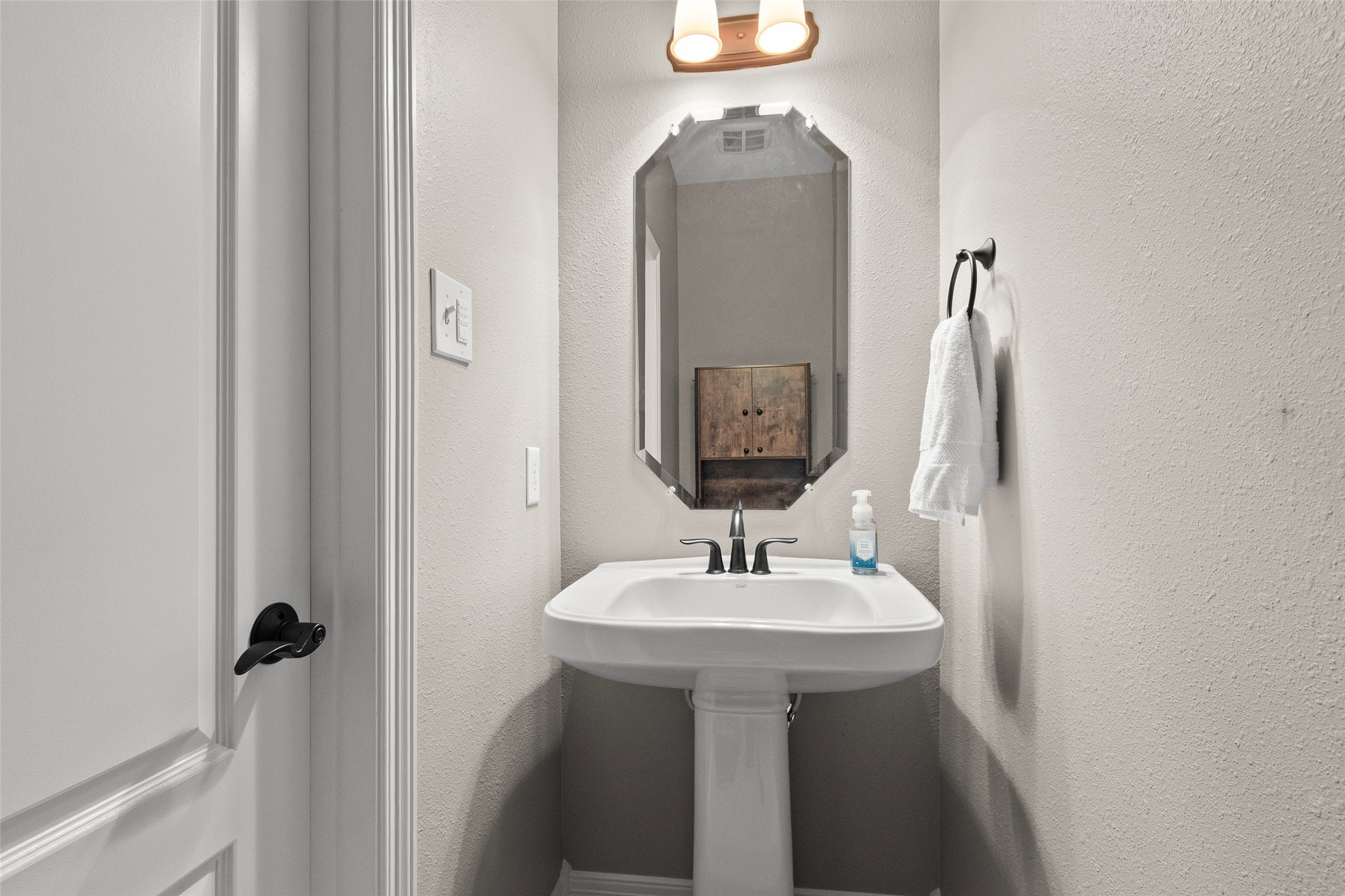 1/2 bath located upstairs