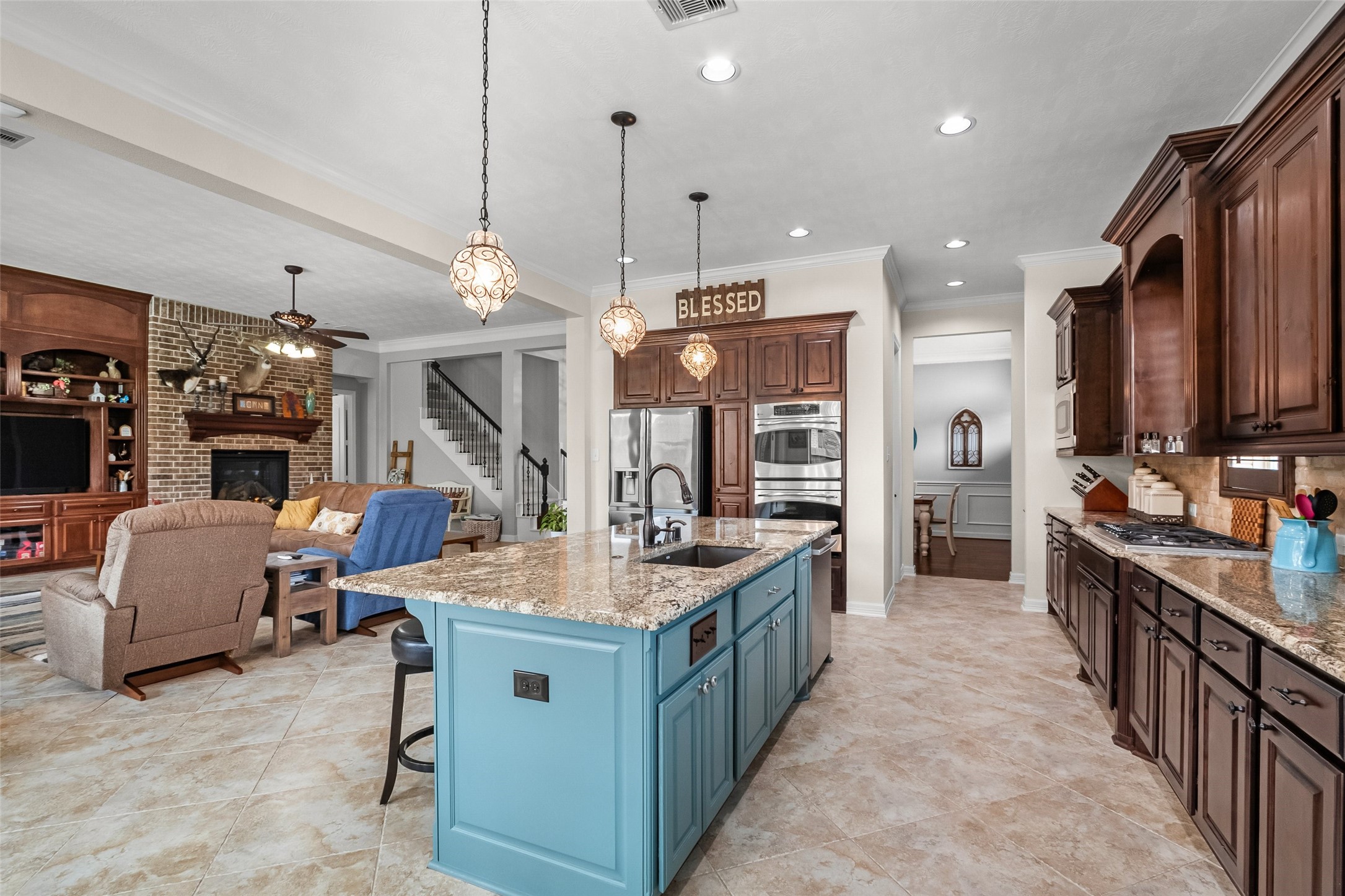 Very large island in the kitchen, upgraded pendant lighting, touchless kitchen sink faucet, loads of counter space, pots & pan drawer, knotty alder cabinets per previous seller.  The sellers have a reverse osmosis system that they removed, but are leaving it for the buyers to re-install if wanted.