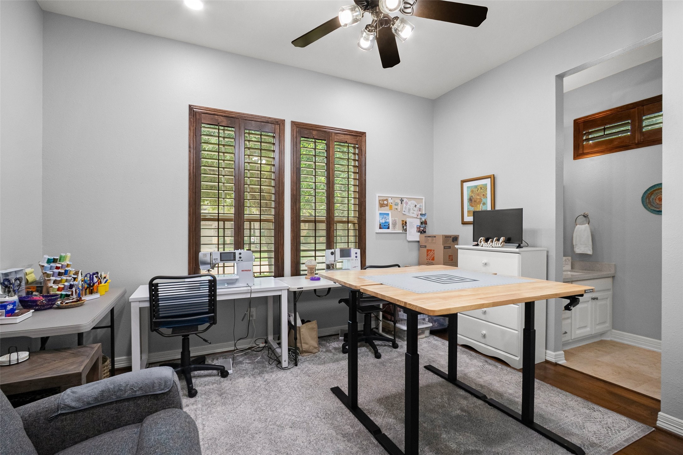 This is the front bedroom , and part of the connection to the en-suite bathroom connecting to another bedroom.  This bedroom currently used as a sewing room.