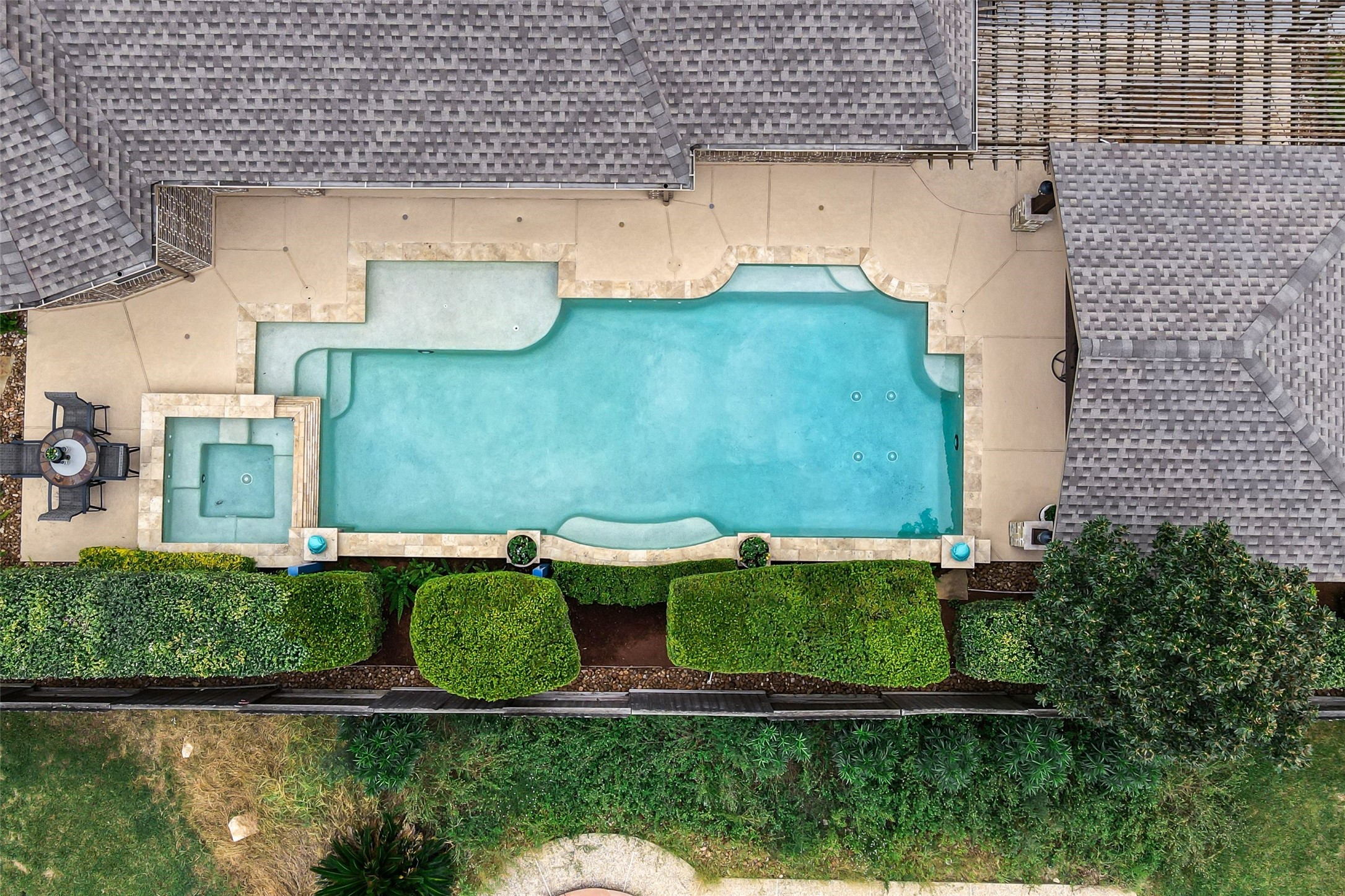Aerial look at a portion of the backyard gives a great perspective to the pool/spa & pergola.