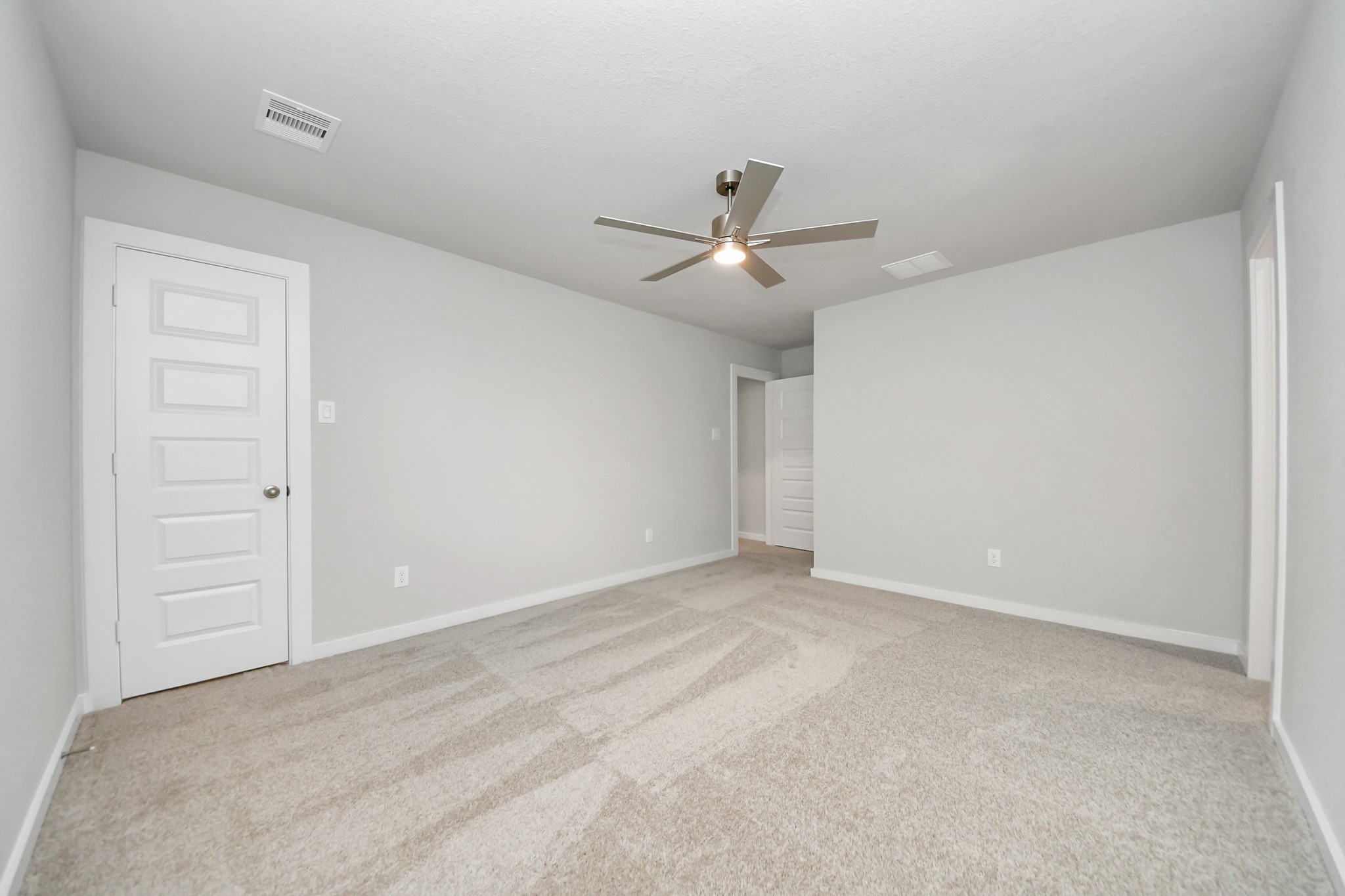 Generously sized secondary bedrooms featuring spacious closets, soft and inviting carpeting underfoot, large windows allowing plenty of natural light, and the added touch of privacy blinds for your personal retreat. Sample photo of completed home with similar floor plan. Actual colors and selections may vary.