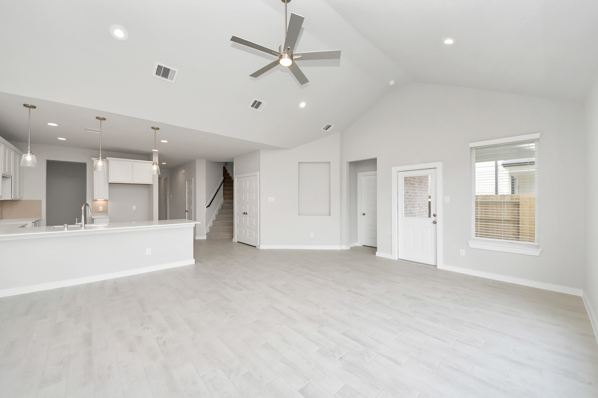 Take another glimpse into the heart of the home with this additional view of the family rooma sprawling space ready to accommodate all your gatherings. Sample photo of completed home with similar floor plan. Actual colors and selections may vary.