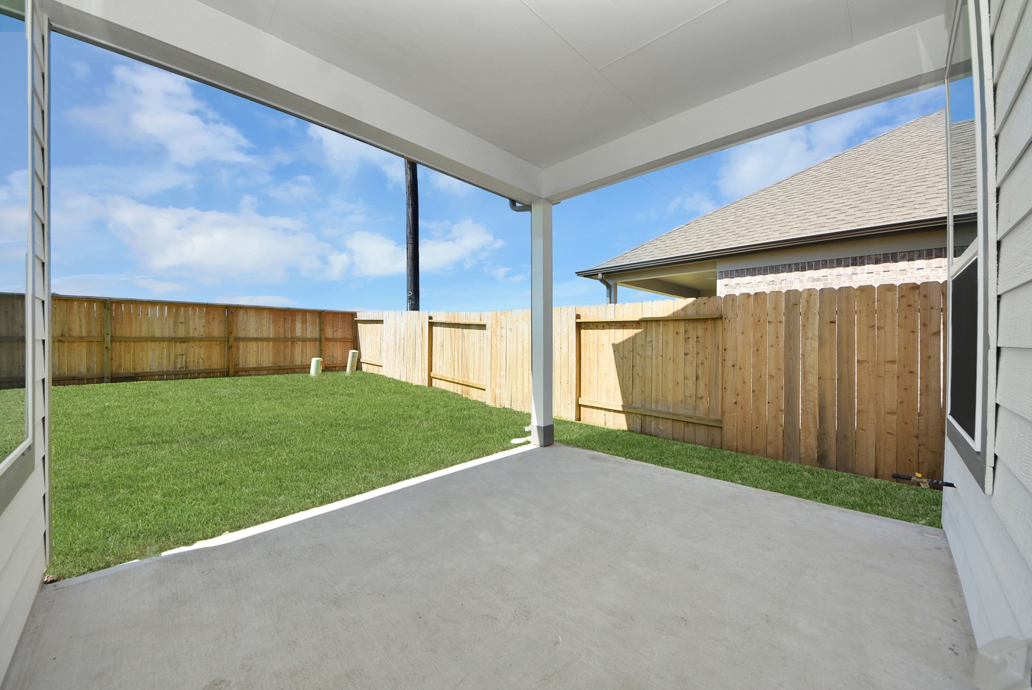 Come and see this spacious backyard with its beautiful covered patio. There is plenty of room for the kids to play and adults to relax. Perfect for your outdoor living space, patio furniture, bbq pit, and so much more. The possibilities are endless!