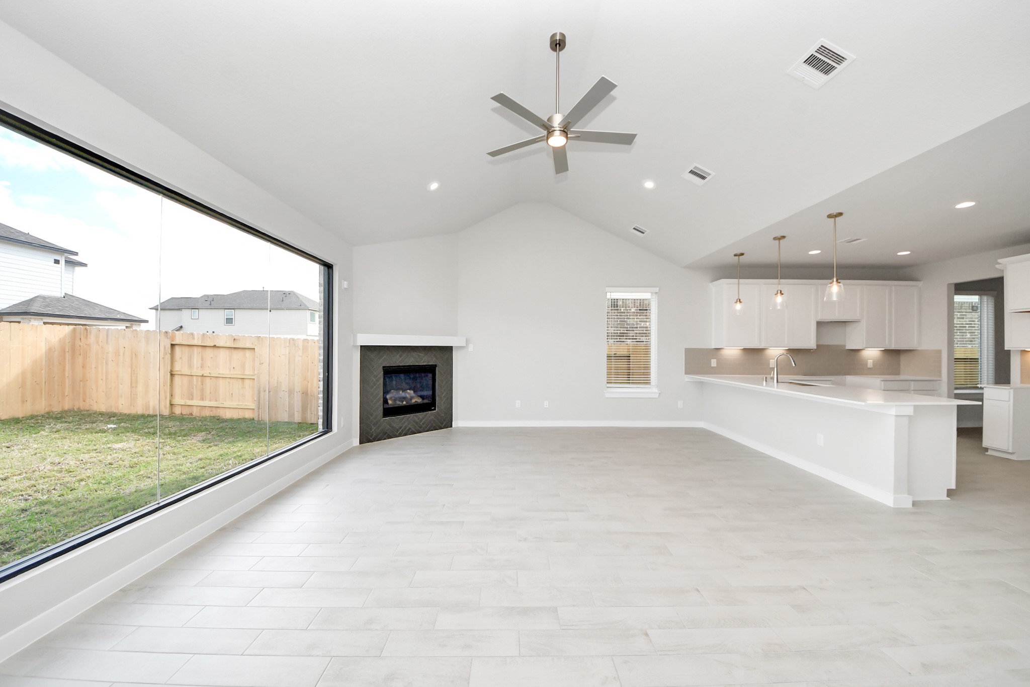 Take another glimpse into the heart of the home with this additional view of the family rooma sprawling space ready to accommodate all your gatherings. Sample photo of completed home with similar floor plan. Actual colors and selections may vary.