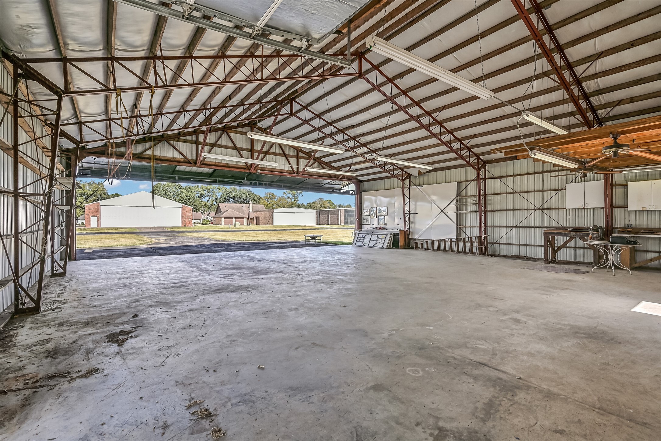 Designed with aviation in mind, the spacious hangar opens directly toward the Polly Ranch community airstrip. The large hangar door provides access to the private taxiway leading to the 3,070' asphalt runway, while the generous interior offers room for aircraft storage, maintenance, and equipment.