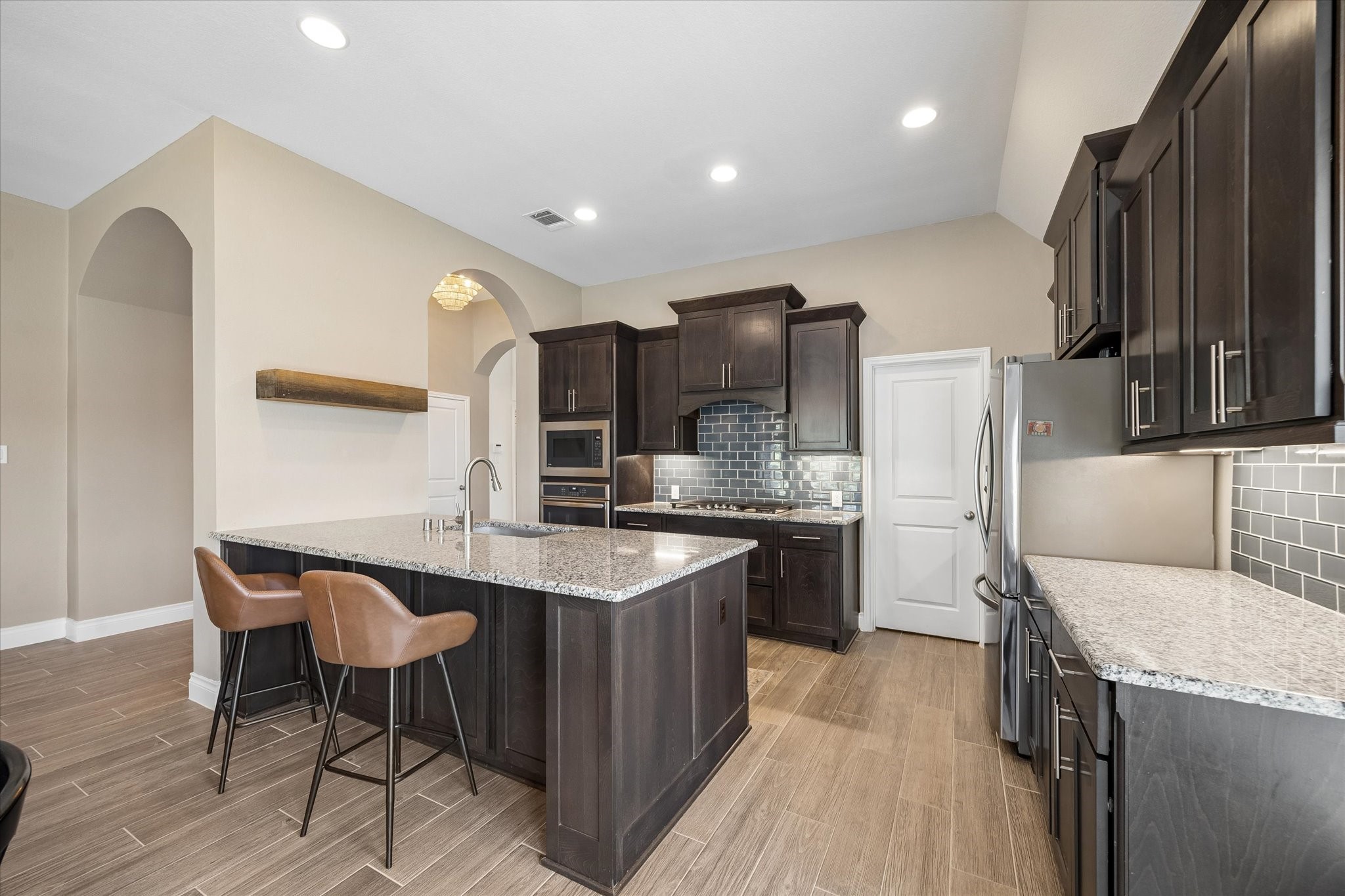 Gorgeous kitchen is a chef's dream with ample quartz counter space.