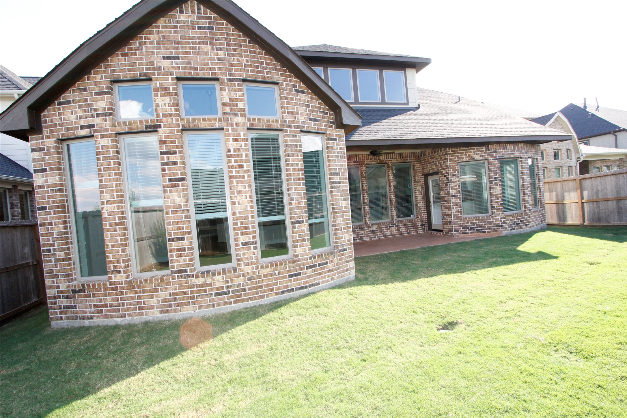 Back patio for relaxation and back view of the house