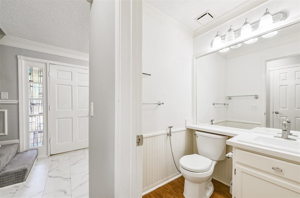 Chic and modern half bathroom  where style meets function in every square foot. Your guests will be impressed by this elegant space!