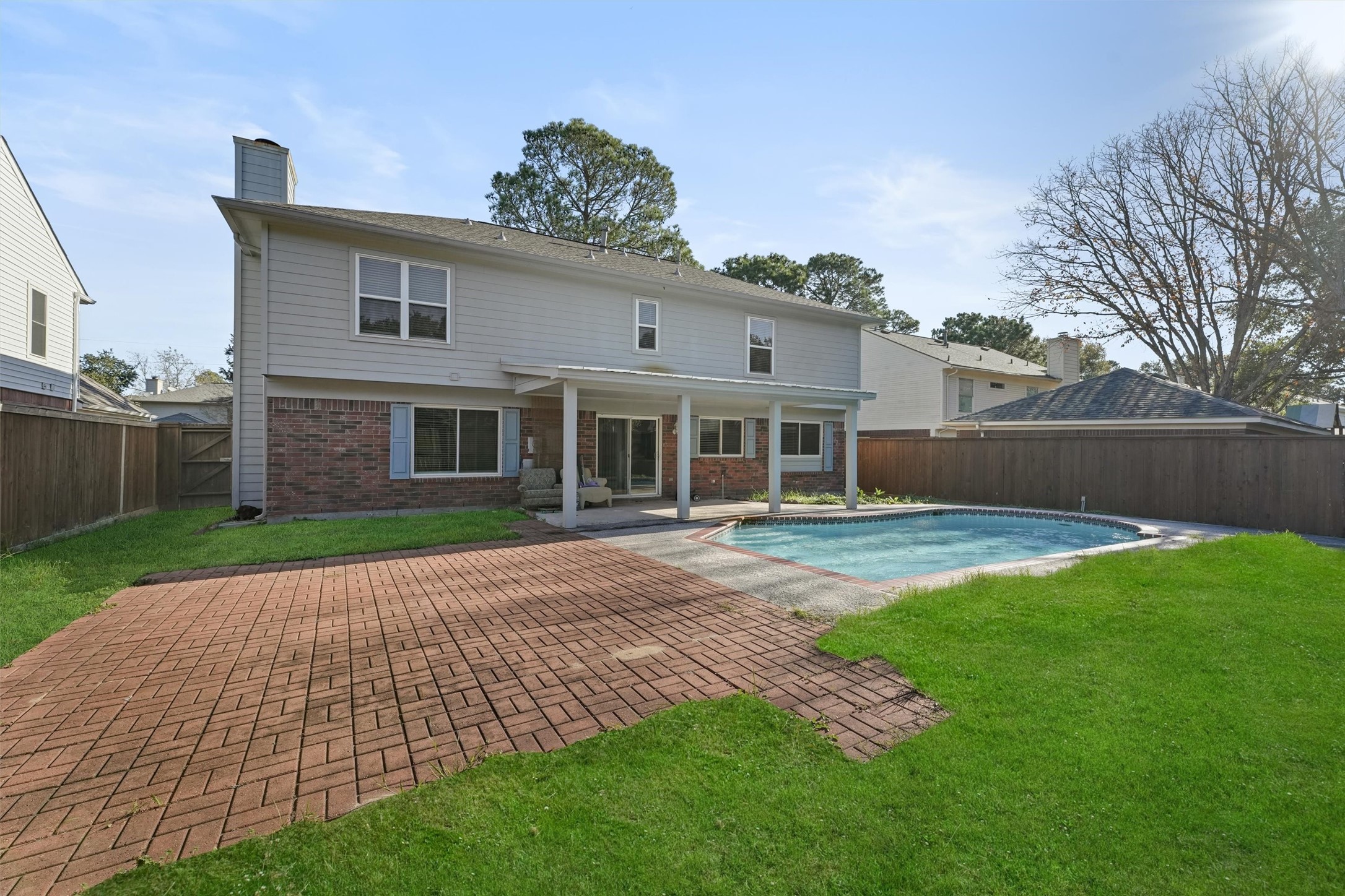 Embrace resort-style living in your own backyard oasis  a spacious retreat featuring a sparkling pool, perfect for endless summer days and entertaining under the Texas sky.