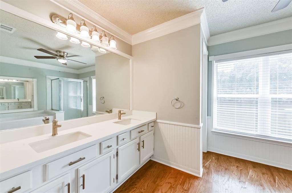 Indulge in luxury every morning in this elegant master bathroom featuring dual sinks, providing both convenience and style for a spa-like experience at home. Your daily routine just got an upgrade