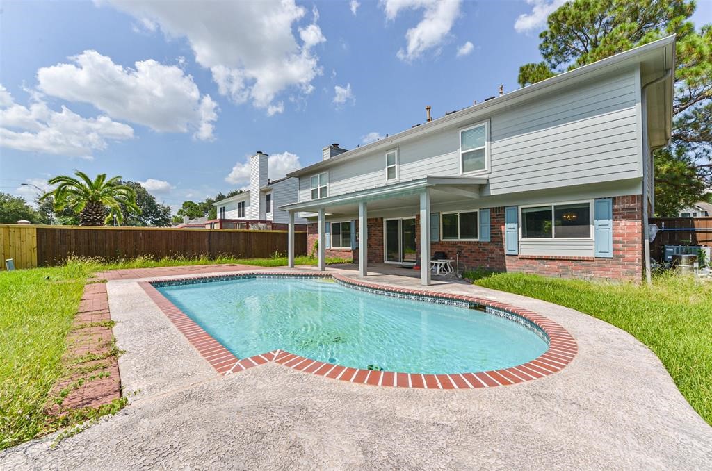 Embrace resort-style living in your own backyard oasis  a spacious retreat featuring a sparkling pool, perfect for endless summer days and entertaining under the Texas sky.