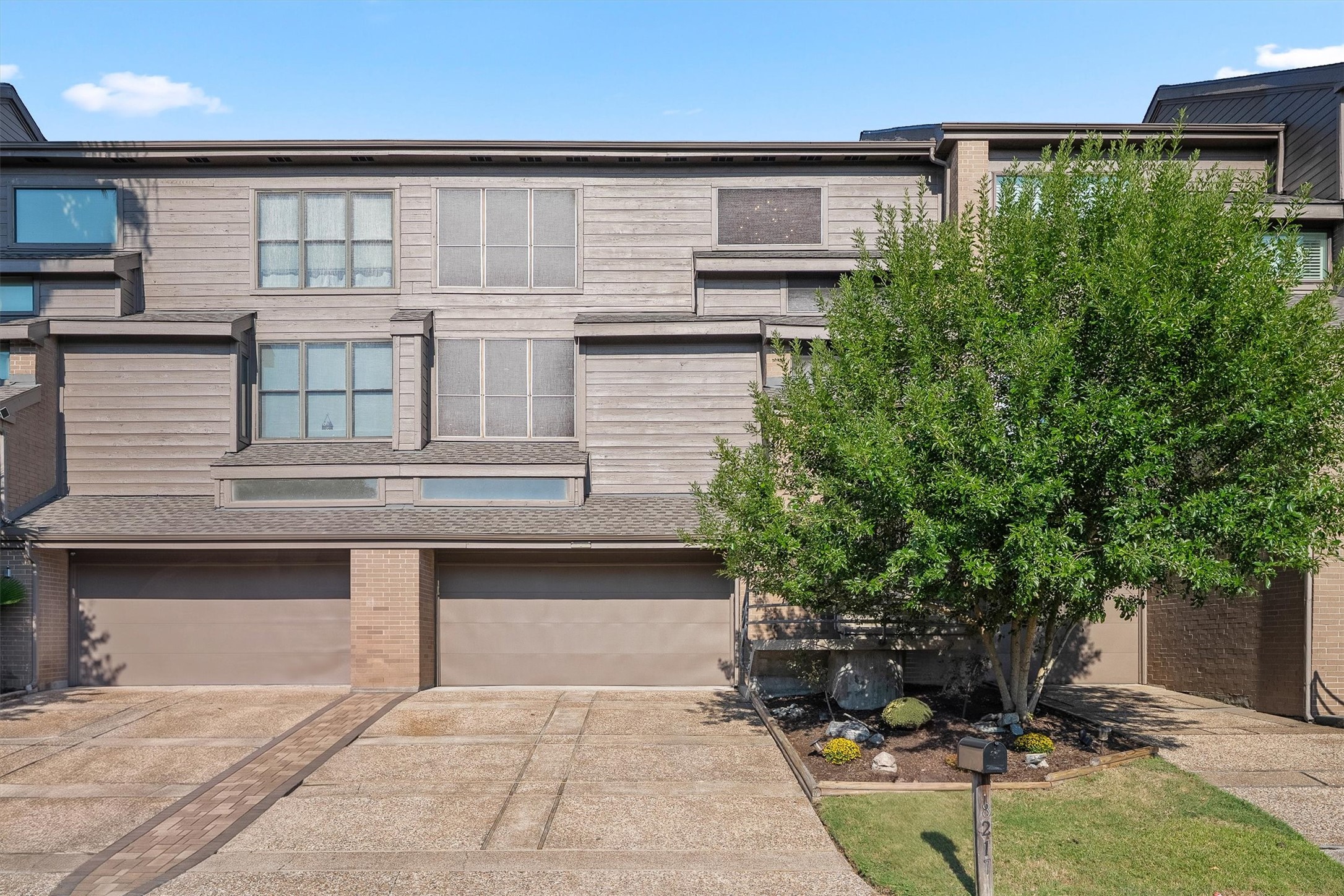 Striking curb appeal highlighting the home's contemporary facade.