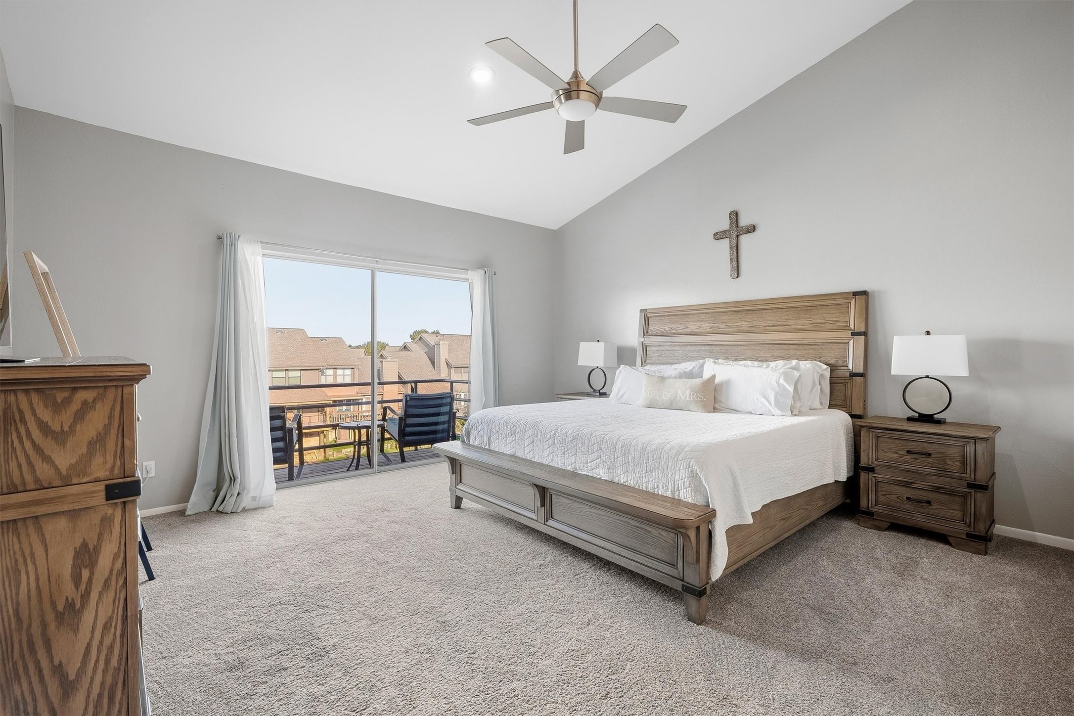 Peaceful primary bedroom sanctuary with private balcony access.