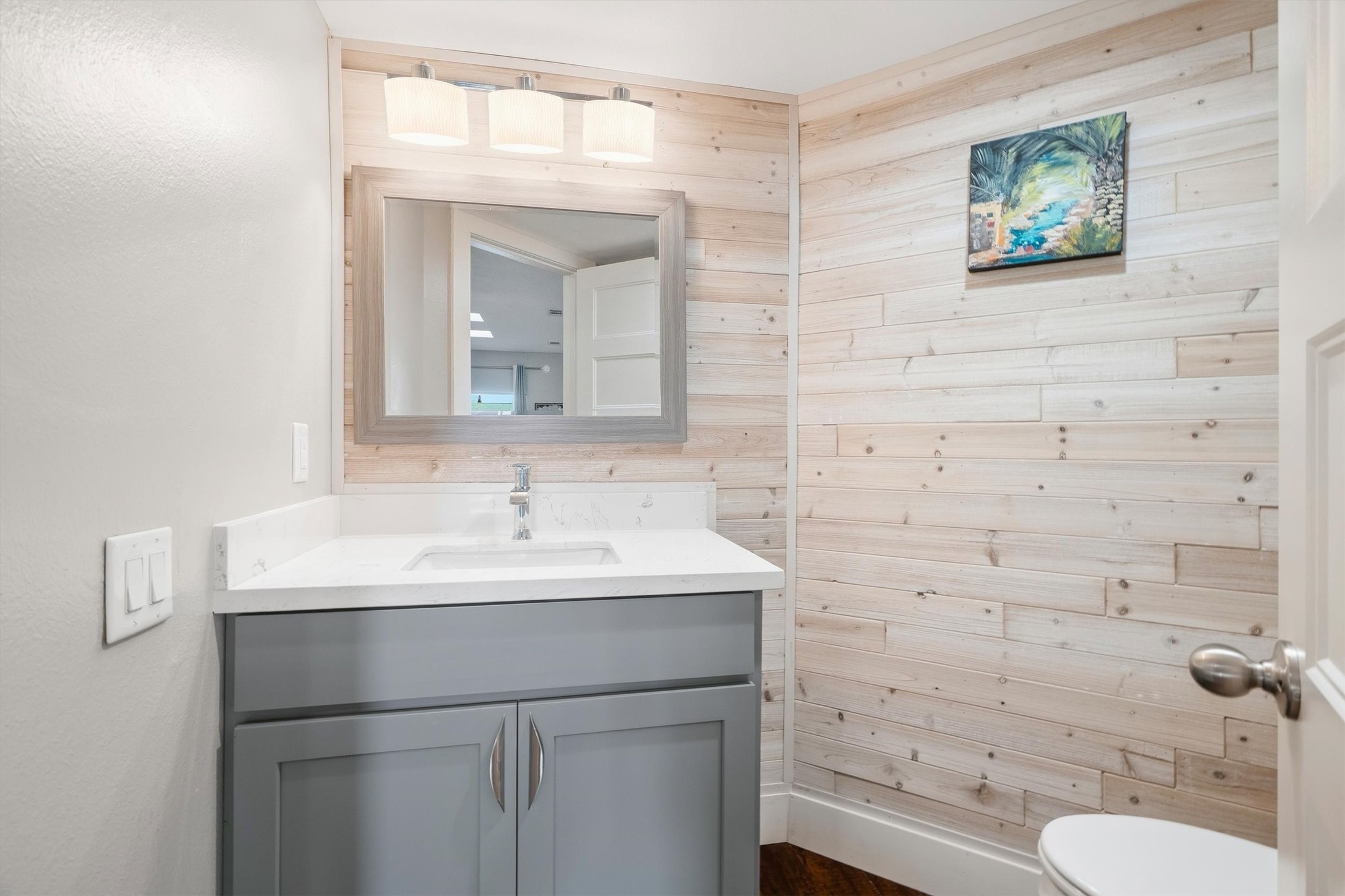 Half-bath stylishly finished for guests.