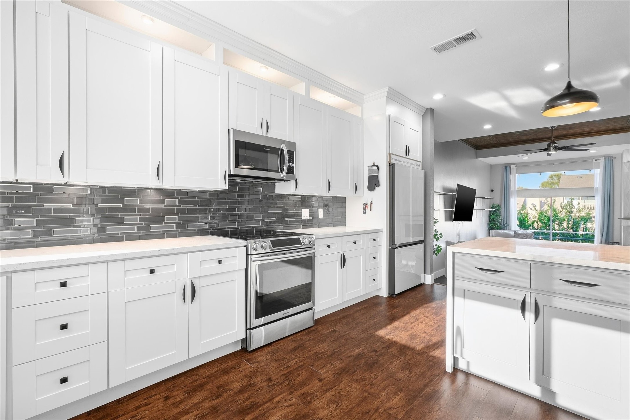 Kitchen opens directly to living room.