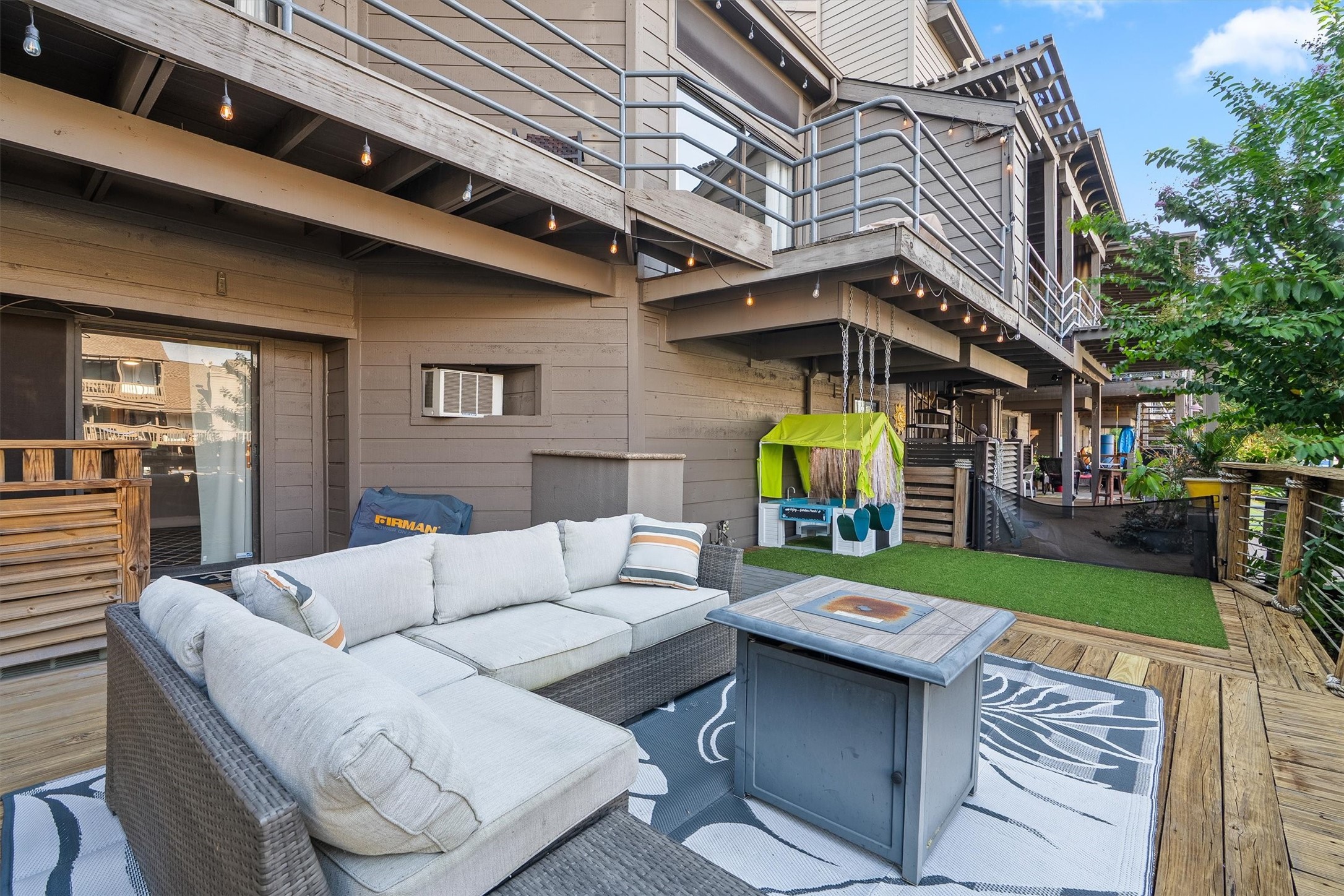 Spacious lower level deck for outdoor entertaining.