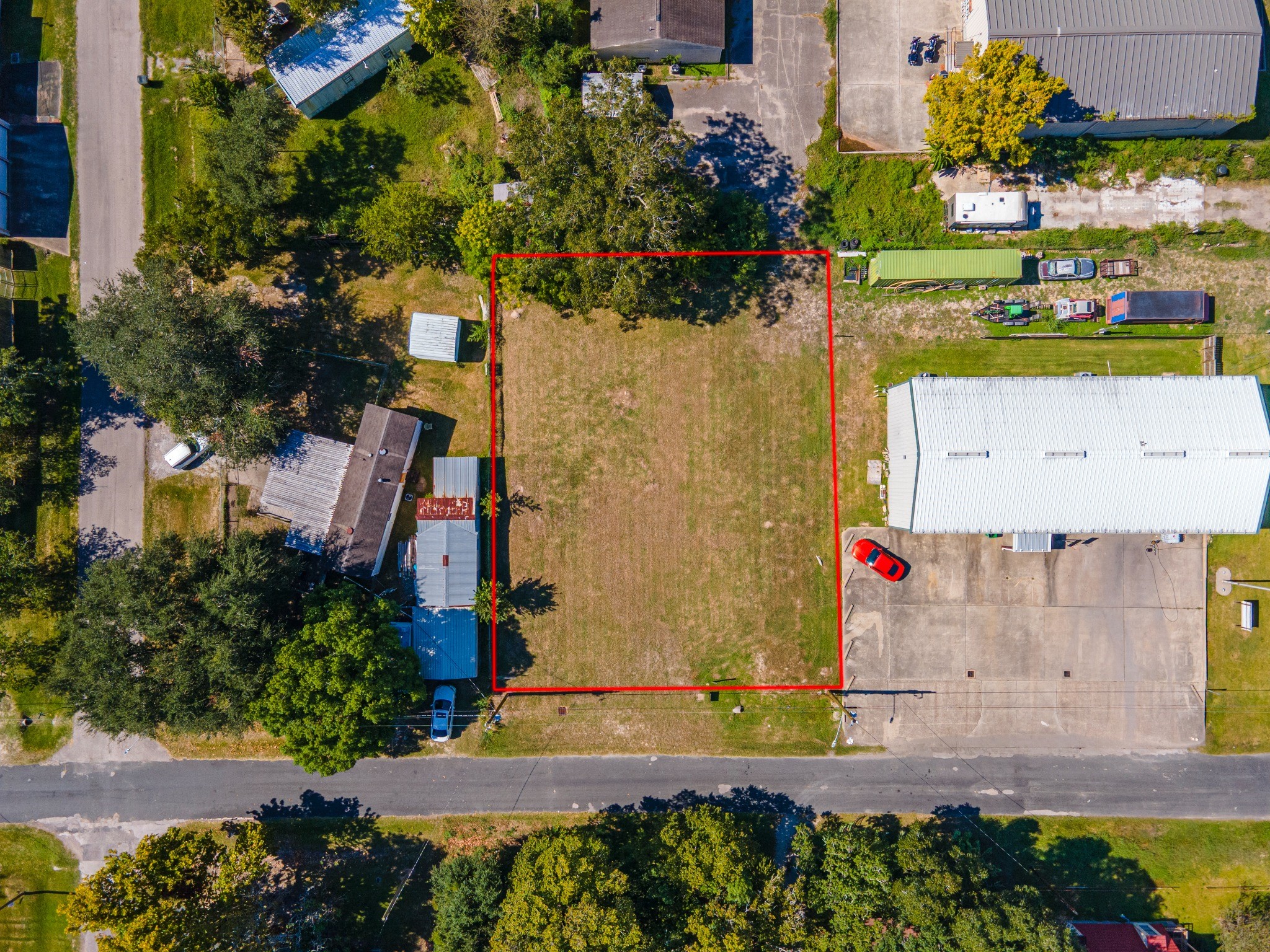 Overhead view with approximate property boundaries outlined in red. Overhead view with approximate property boundaries outlined in red.