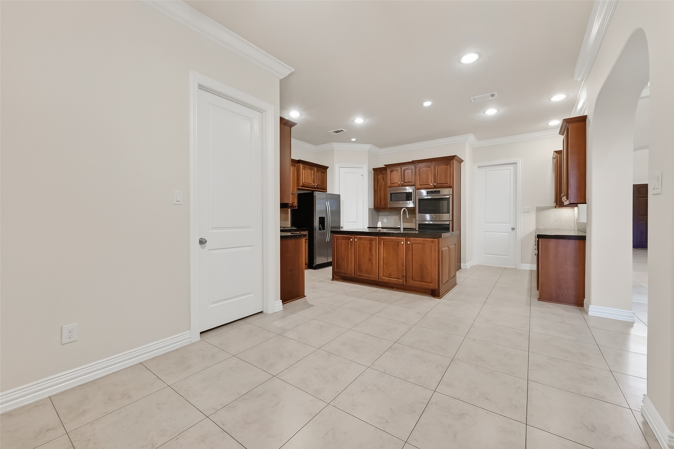 Access to the 3 car garage donveniently located by the kitchen.