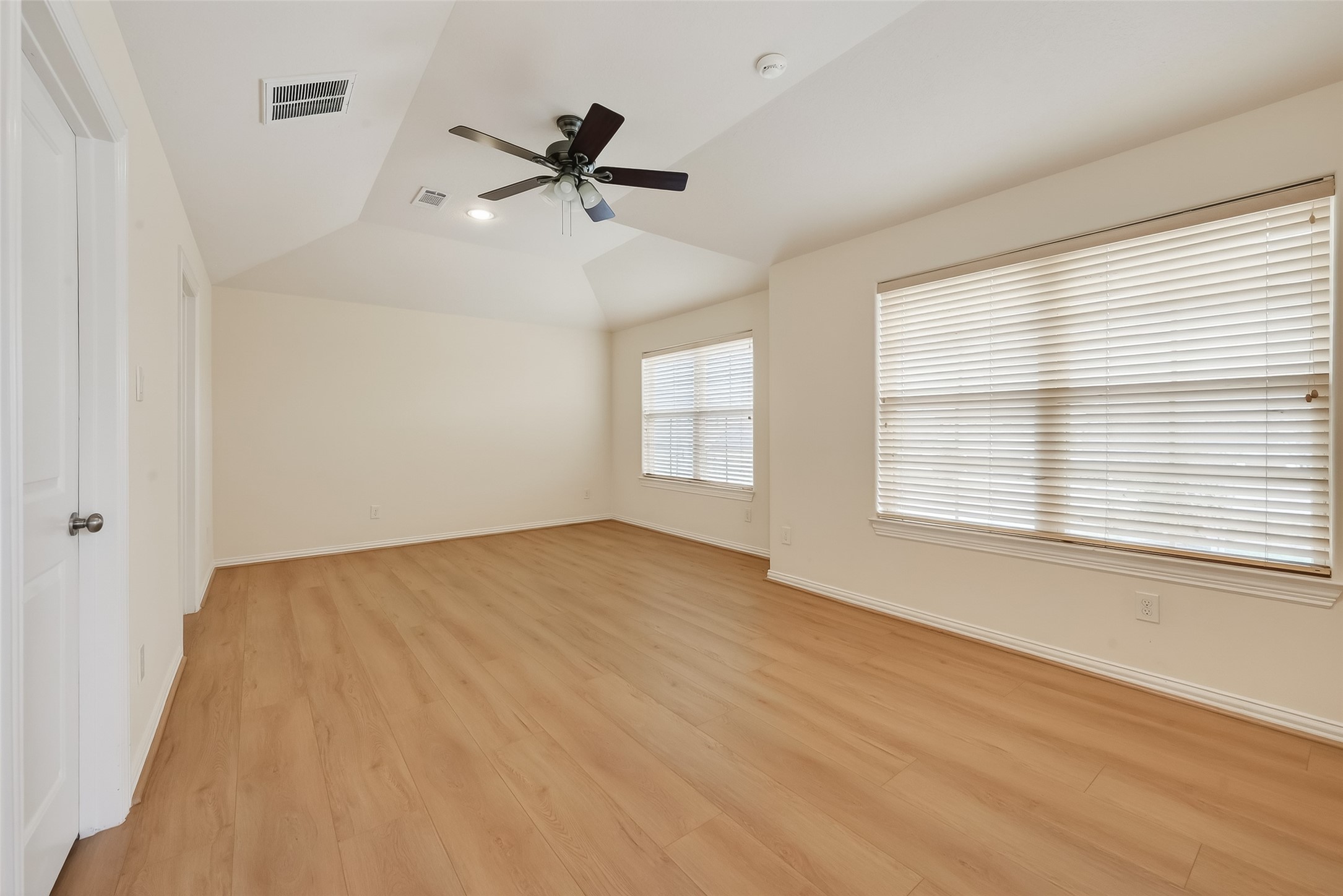 Spacious Fourth Bedroom with plenty of natural light, walk in closet and great views of the front yard plus access to the front balcony.