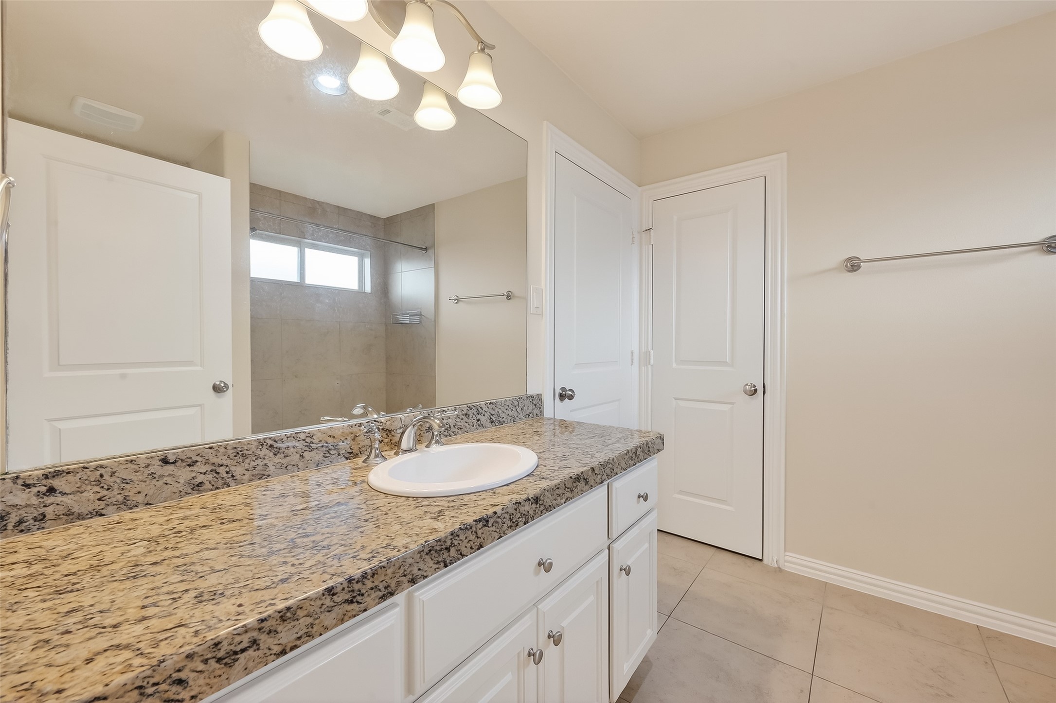Secondary Bathroom shared between secondaries second and third bedroom.