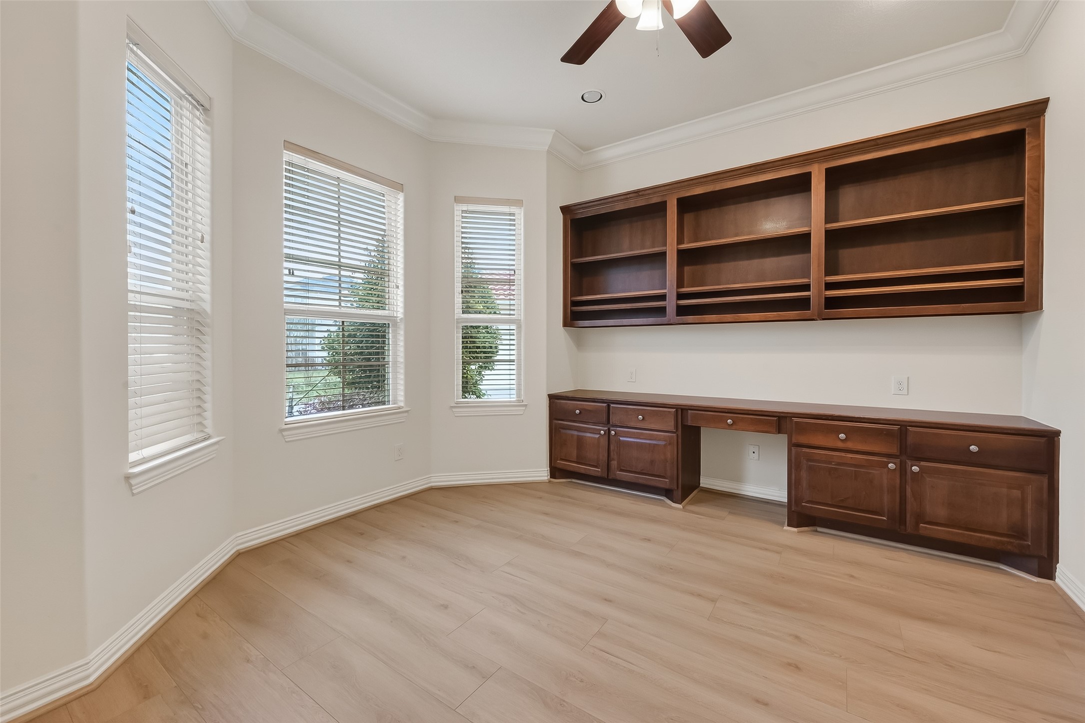 Study offers great views of front yard, nice built in desk and bookshelf with variable shelves.