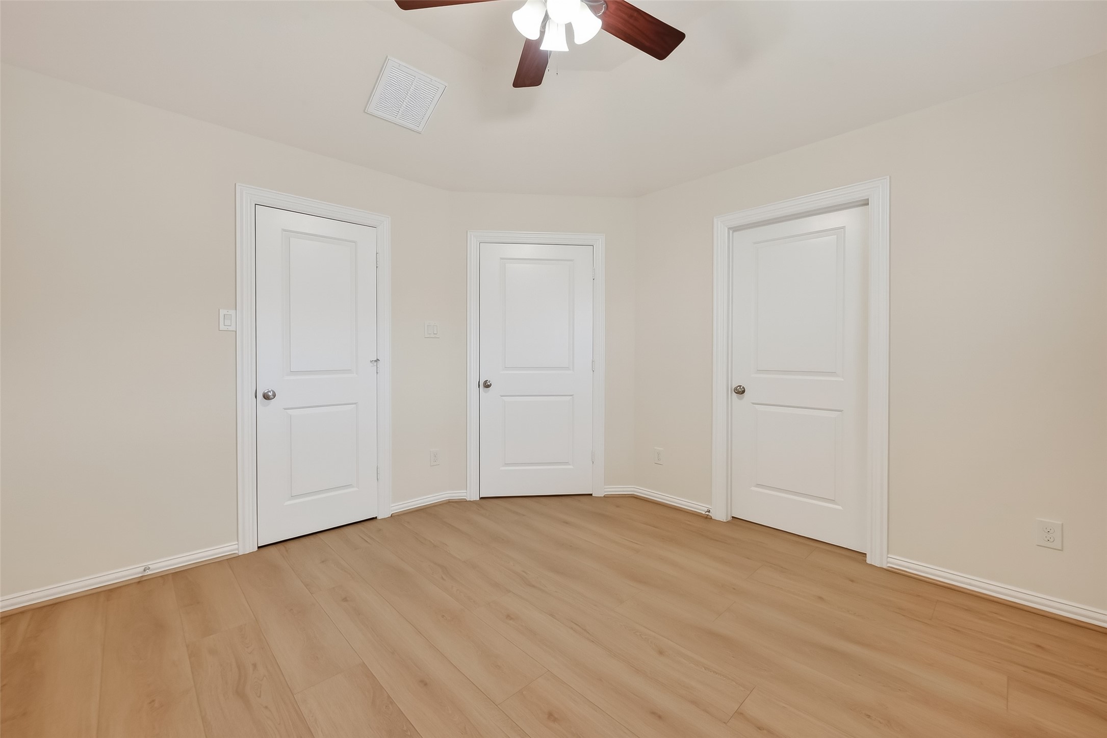 Secondary Bedroom offers vinyl wood flooring a walk in closet and access to the share bathroom.