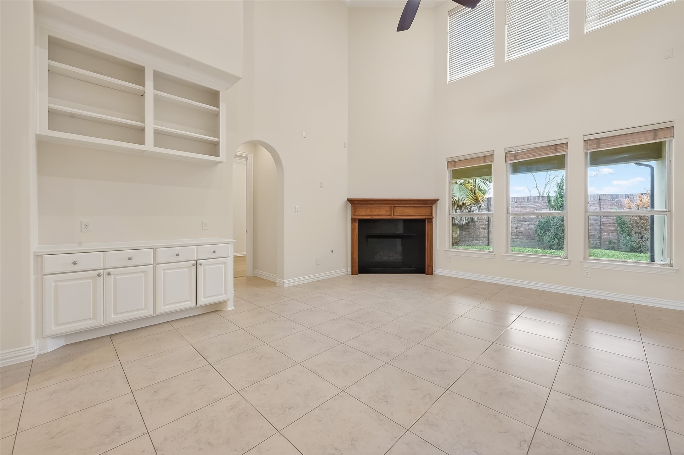 Main Living Room presents a double height ceiling and offers great views of the covered veranda.