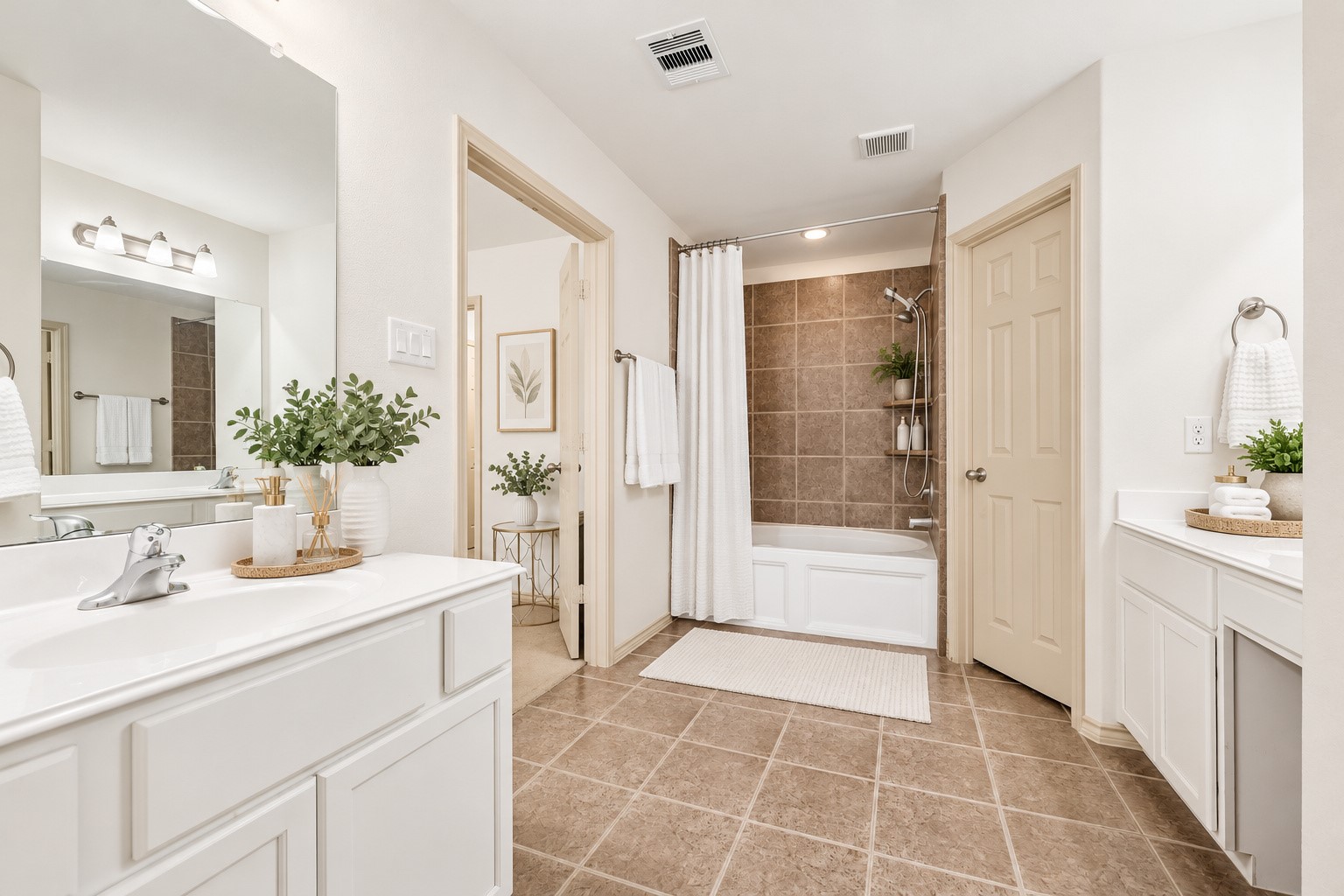 Primary Suite features two vanities, soaking tub and ample storage space.