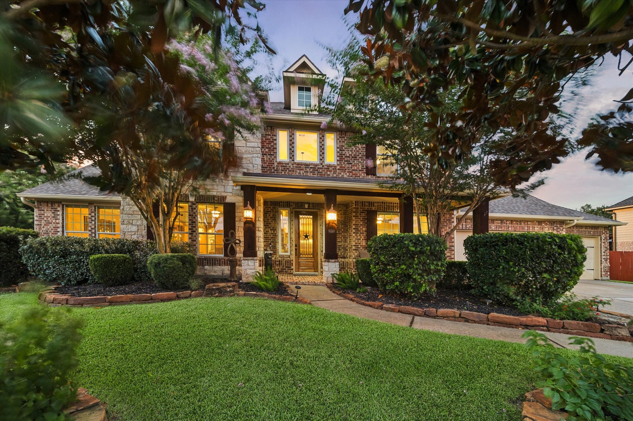 Welcome Home to Waterstone Estates. A captivating first impression, where timeless architecture, mature landscaping, and lush surroundings come together to create a warm and elegant welcome to this exceptional residence.