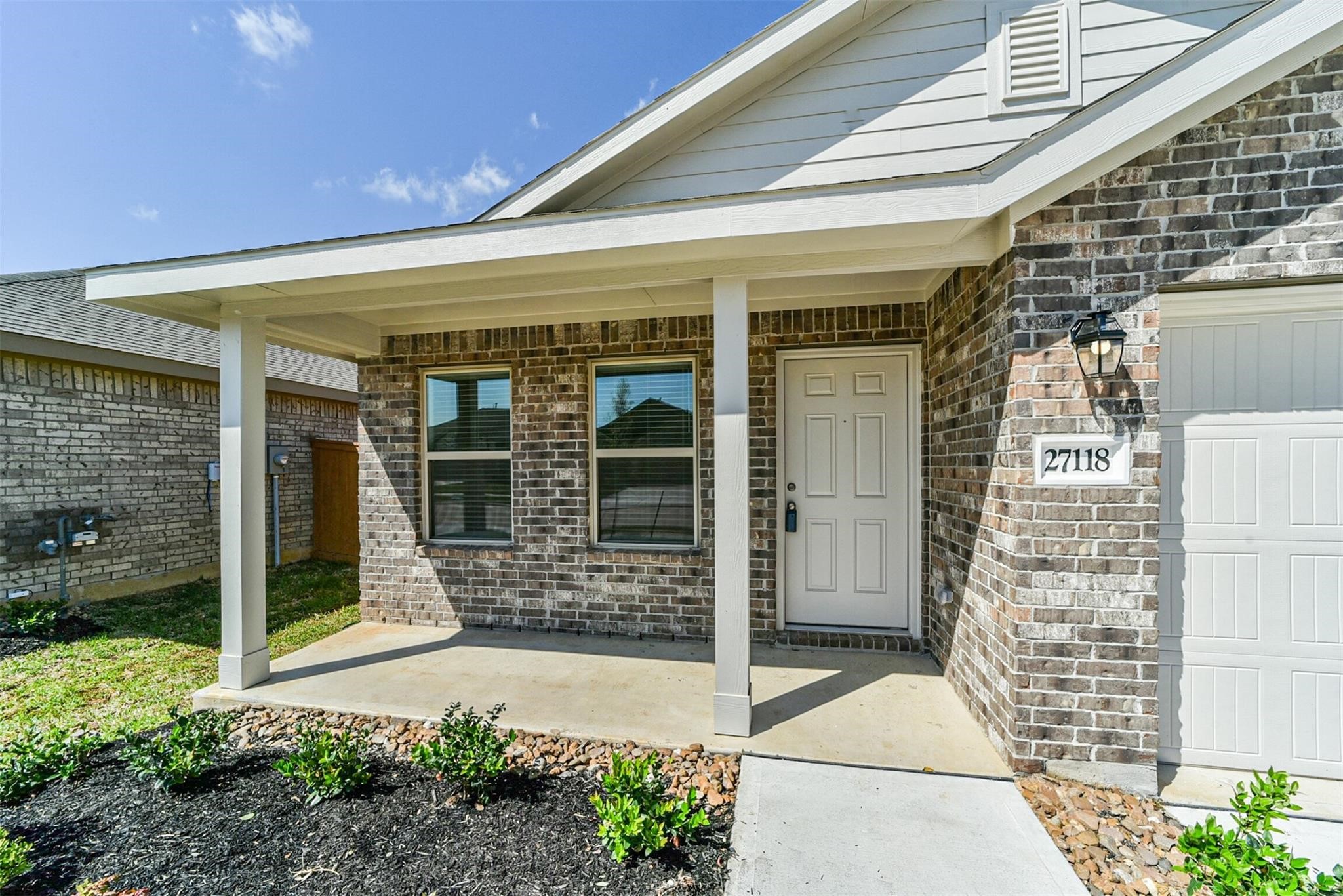 Covered front porch entry providing a warm and welcoming entrance.