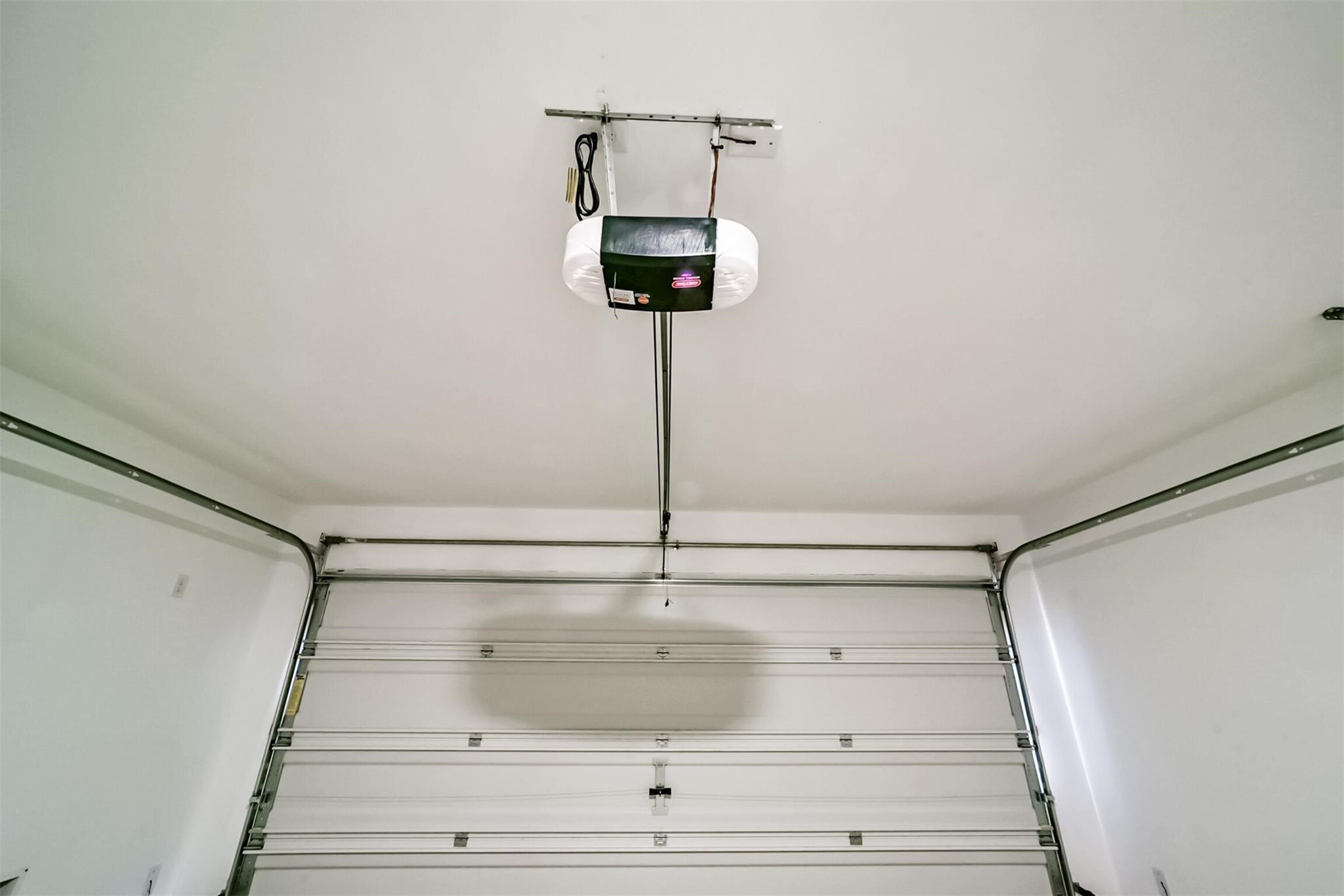 Great sized two-car garage offering plenty of parking and storage space, equipped with an automatic garage door opener.