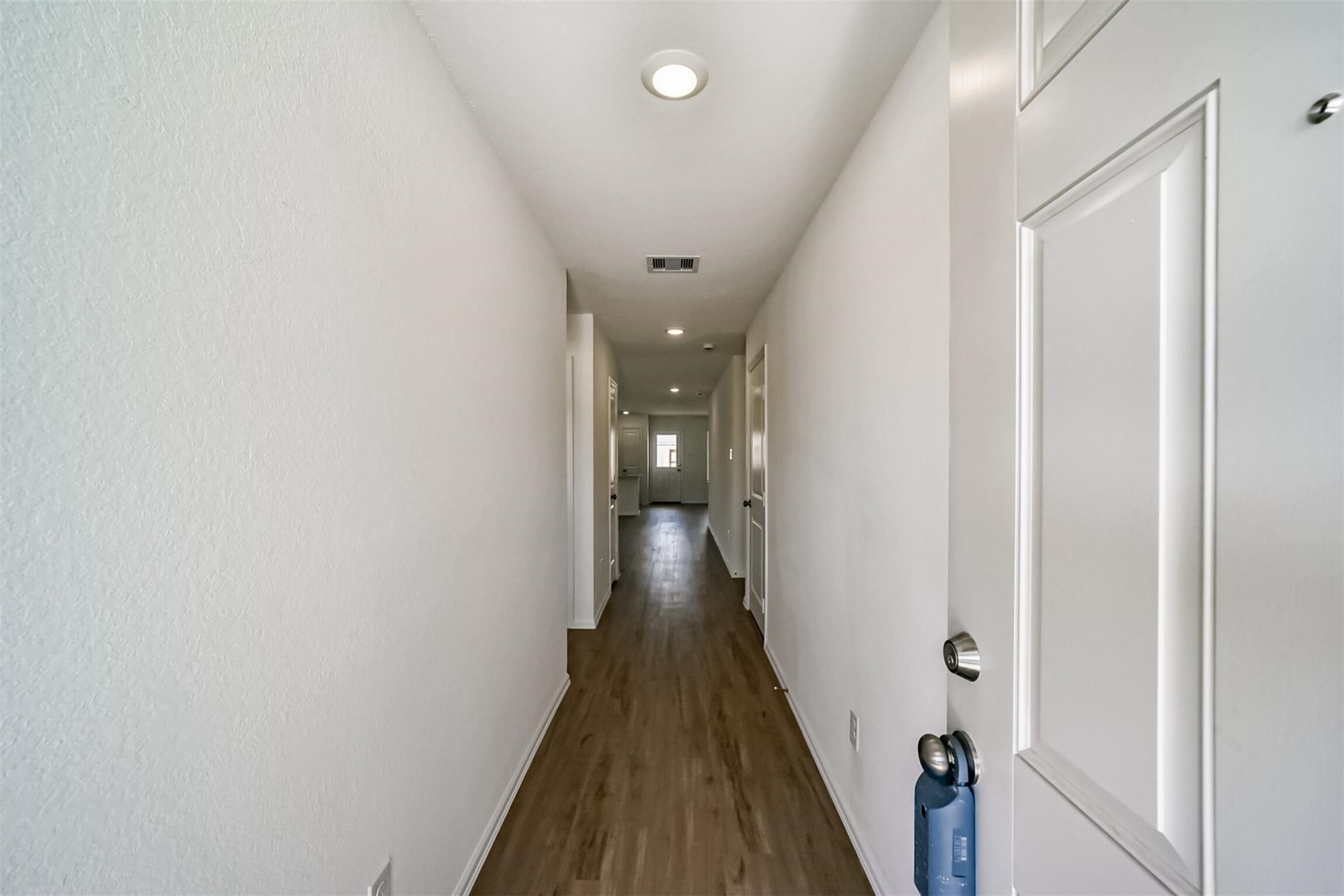 Spacious foyer and hallway leading into the main living areas