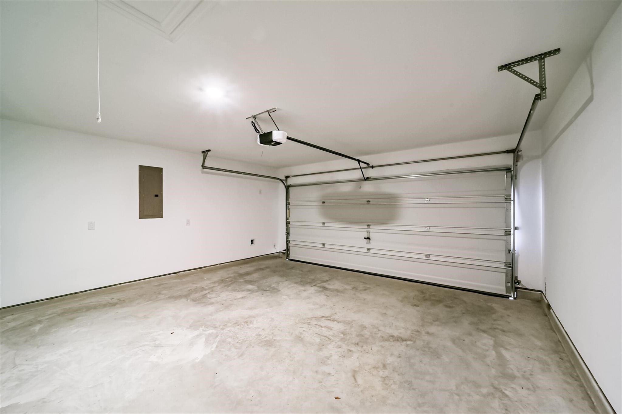 Great sized two-car garage offering plenty of parking and storage space, equipped with an automatic garage door opener