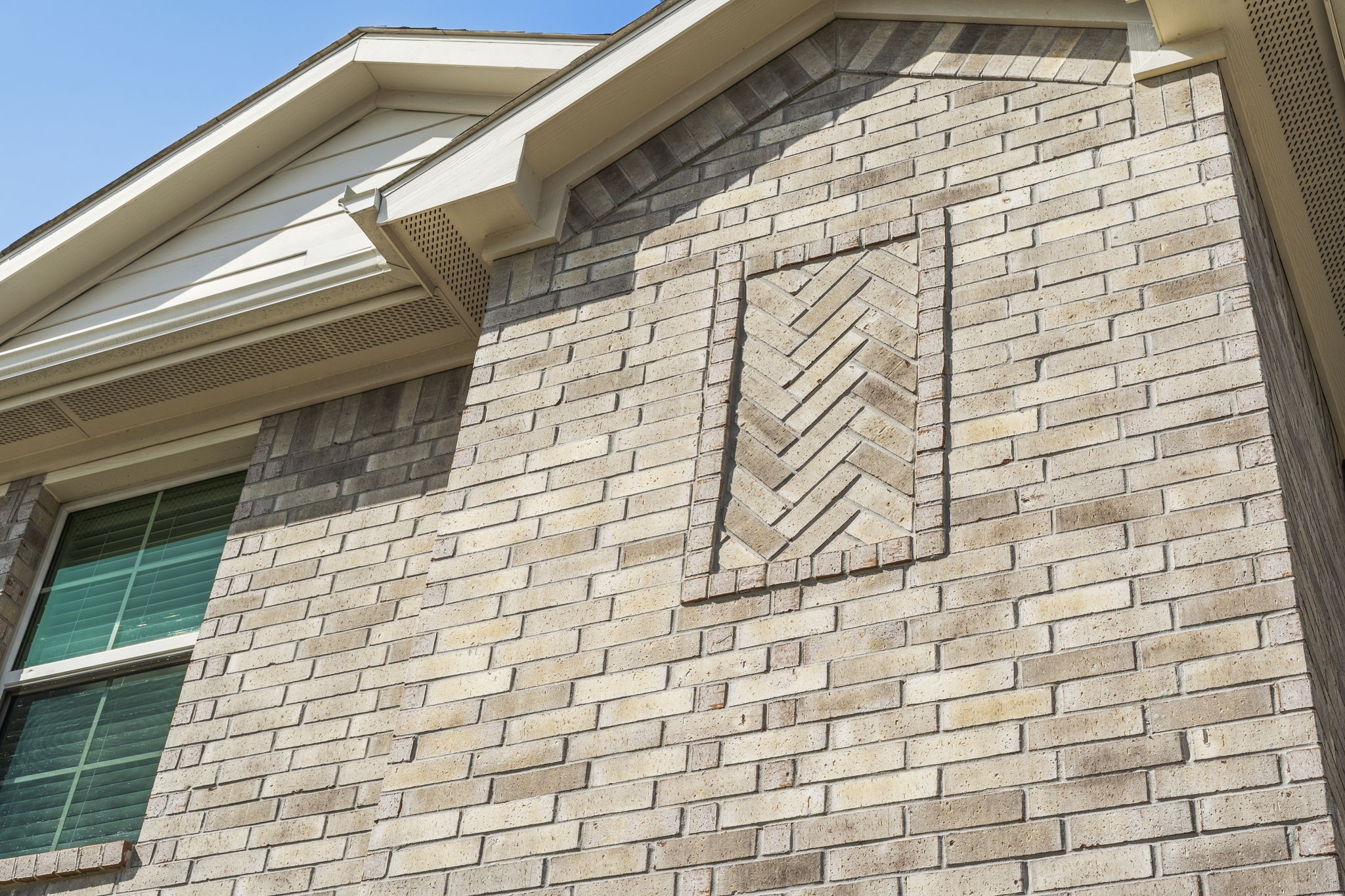 The brick features a distinctive design, adding character and visual interest to the home's exterior.
