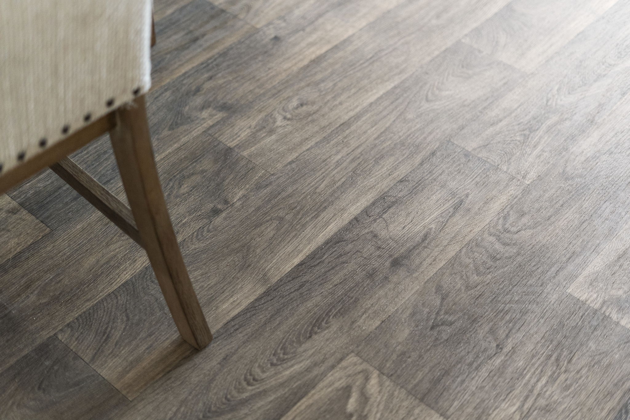 The vinyl flooring offers a sleek, modern look while providing durable, easy-to-maintain surfaces throughout the home.