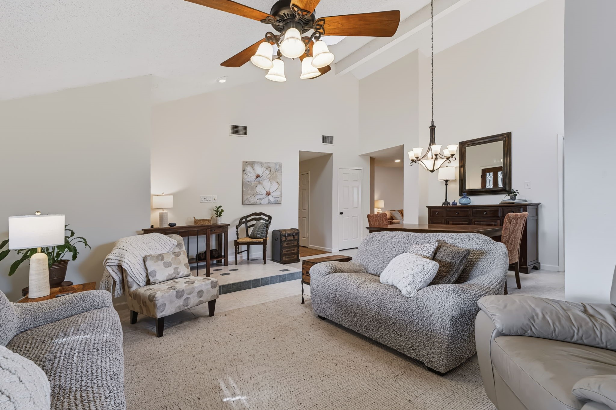 The open flow between the living and dining rooms creates a seamless, spacious layout.