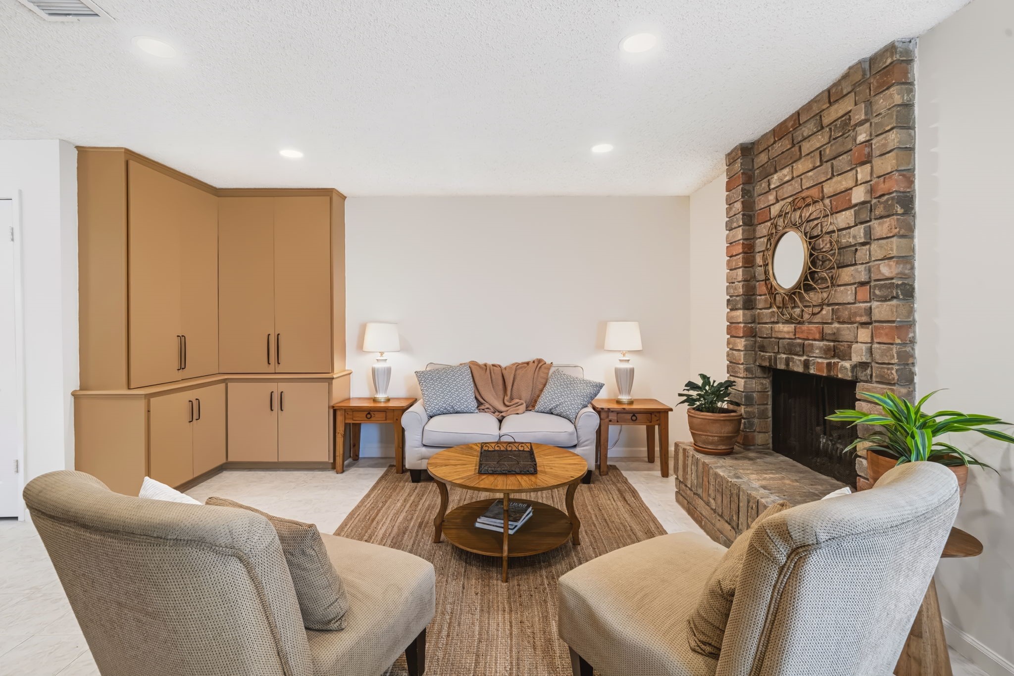 Built-in storage cabinetry maintains a clean, uncluttered feel in the family room.