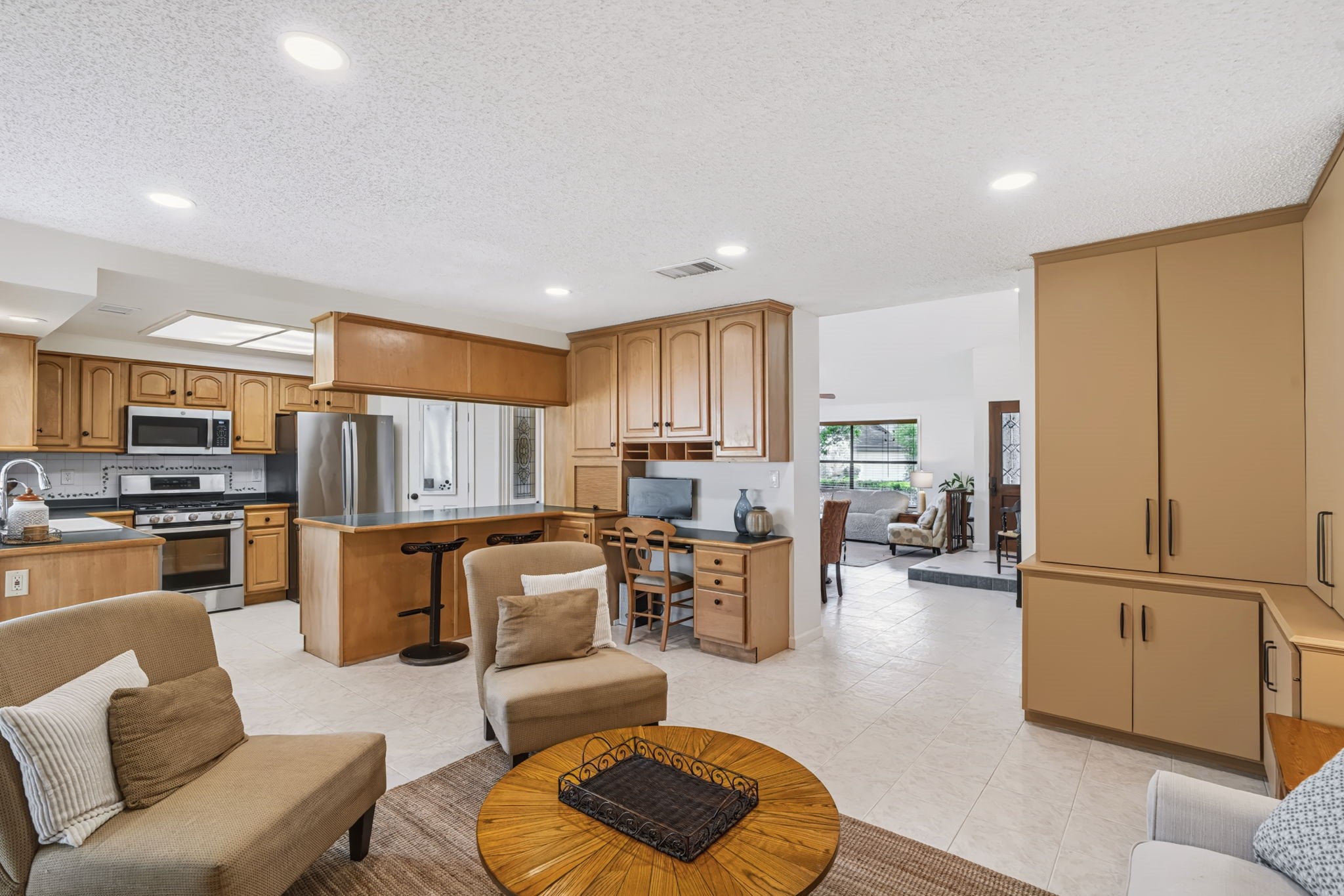 The family room flows seamlessly into the living and dining rooms.